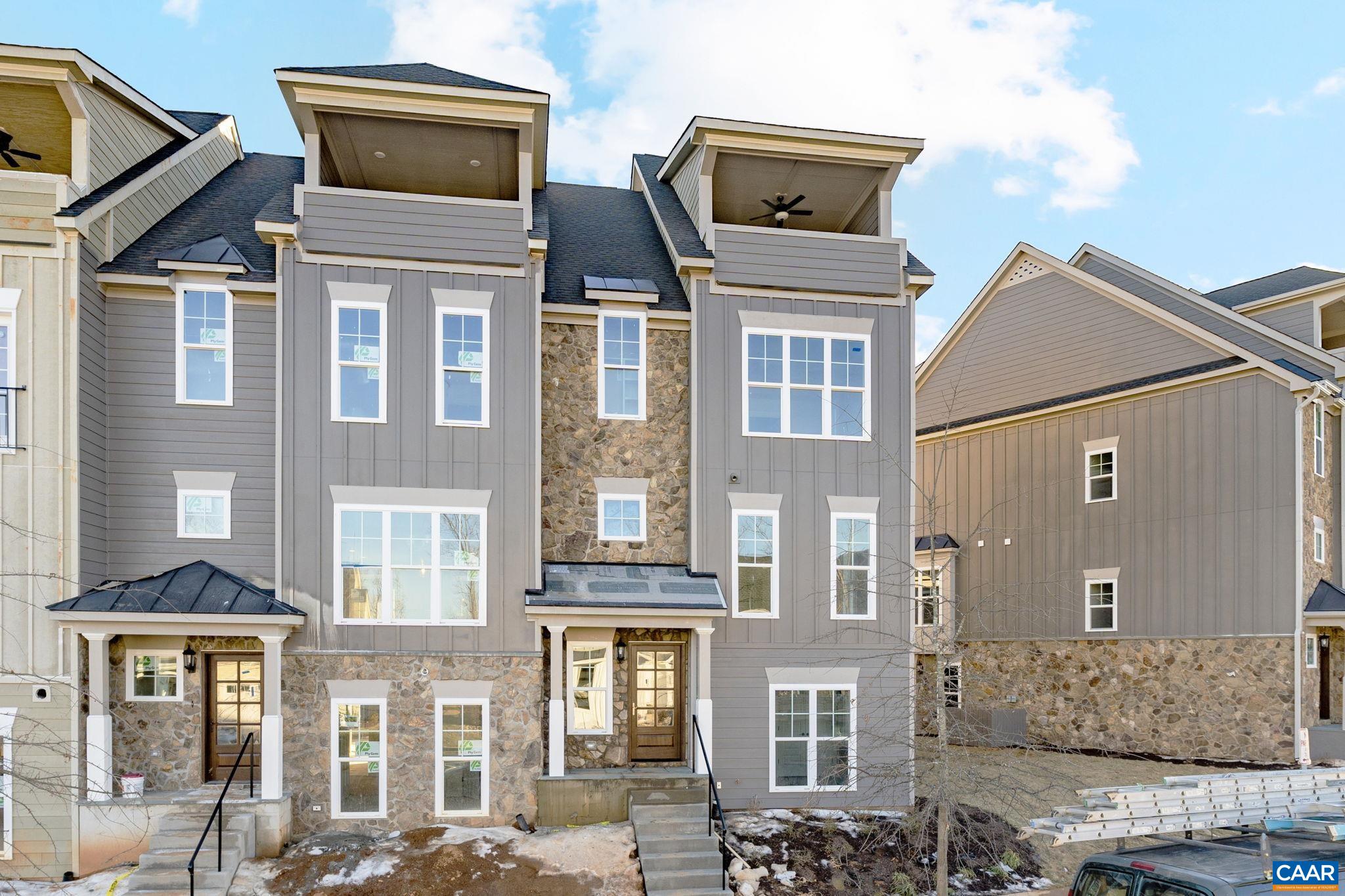 Move-In Ready, End-Unit Townhome with Rooftop Veranda and Blue Ridge Mountain Views! This End Unit Towne includes 4 Finished Floors, Residential Elevator servicing all 4 Floors, Rooftop Veranda and potential rental income with 1st Floor Bedroom/Bath dependency/ADU. This townhome is designed to capture the beautiful Crozet views while incorporating thoughtful, included features and spacious living spaces throughout. Starting with a 2-Car Garage, finished bedroom and full bath dependency/ADU on the lower level, you can head to the open 2nd Level for entertaining in your Kitchen, Great Room with Fireplace, Dining Room & spacious Trex Screened-In Deck (plus a half bath!). The 3rd Level is home to the private Owner's Suite & Bath, second bedroom, full bath and Laundry Room. The 4th Level comes with a finished Rec Room, full bath, Private Study & show-stopping Veranda. Located in amenity-filled Old Trail, you can enjoy all that this neighborhood & Crozet have to offer! This Townhome is ready for March 2025 Move-In!
