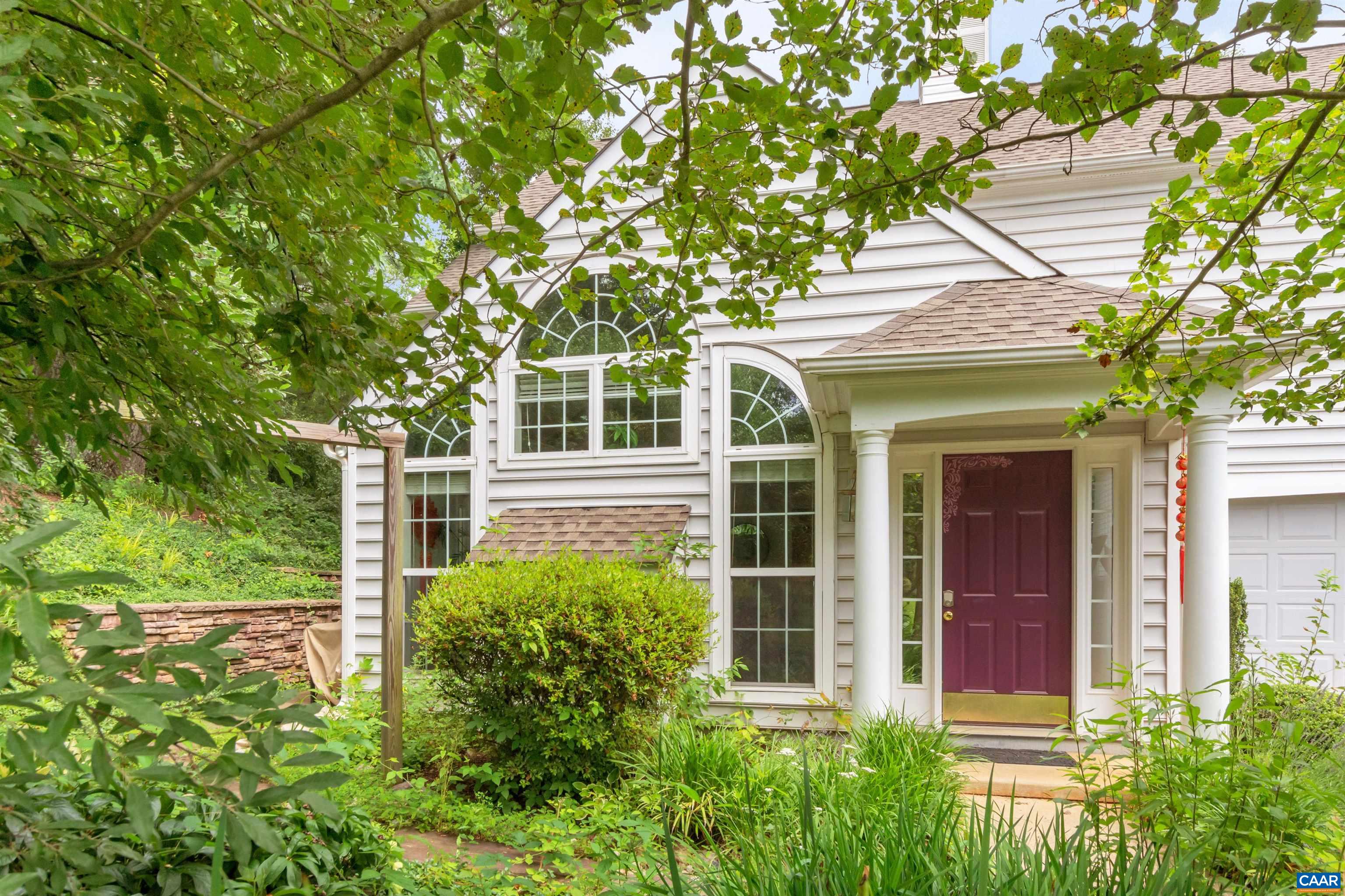 Sun filled home in ever popular Redfields! A short walk away are the wonderful AMENITIES of community pool, playground and nature trails around the lake and through the woods. Yet, you're only 10 MINUTES from UVA grounds and downtown C'Ville. Quiet cul de sac location enhances your enjoyment of the beautiful, flowering landscaping which is all around the home. Property adjoins permanent green space, thus preserving the extra privacy and beauty. The wall of windows, handsome fireplace and cathedral ceiling create an inviting living room. Eat-in kitchen has room for a large table plus there is seating at the counter. Ample counter and cabinet space plus a convenient laundry adjoins it. The 2-car garage has extra storage area, built-in shelving and your own SAUNA! A cathedral ceiling and Palladian window enhance the feel of the spacious owners' suite. It's bath has tiled shower and separate tub with skylight above! Both additional bedrooms have generous natural light, too.