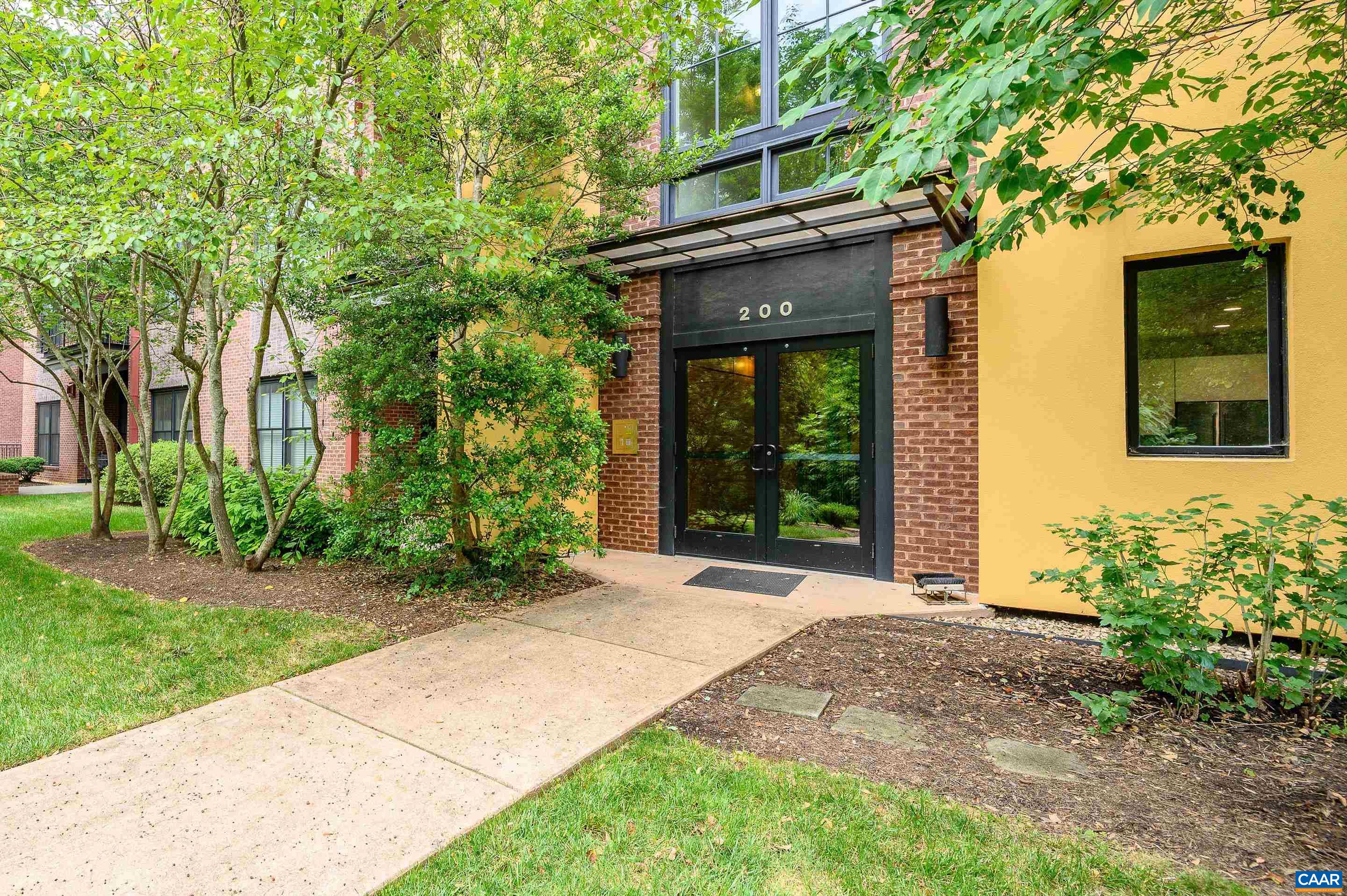 Elegant City living in the heart of Charlottesville. This  stylish and light filled condo is located in the Belmont neighborhood, only a 5 minute walk to the Historic Downtown Mall and just 2 miles from UVA Grounds! Walk to many great restaurants, 2 breweries, theatres and music venues. High ceilings and (almost) floor to ceiling windows offer city views from the living room. Hickory wood floors throughout living spaces, soapstone and granite countertops in kitchen with island, tiled floor and shower in bath, and a modern gas fireplace (Hearthstone, Hase Collection). Outside the building is surrounded by green space, which provides a very quiet and pet friendly environment. Extra storage and one reserved parking space in the lower level garage. Ample space outside for another vehicle and guest parking!