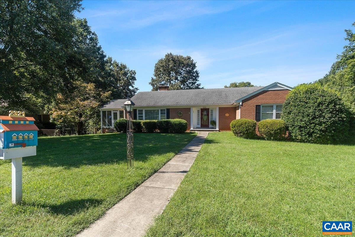 Location, Location, Location. All brick home on corner lot. Quiet street w/ a quick walk to Greenbrier Elementary & Greenbrier Park.  Gleaming well maintained hardwood floors throughout most of main floor. Generous sized bedrooms all on main floor including large walk-in closet for owner's bedroom.  Built-in corner cabinet in dining room and a kitchen just waiting for someone to make it their own not to mention the sun porch for those lazy afternoons.  Two fireplaces, one wood burning in main floor living room and one gas in basement family room.  In the downstairs family room you will find built-in's for library and a very much oversized garage with extra storage, room for vehicles and more room for work area.  There is also an extra storage area under the sun porch.  Laundry/utility room also downstairs with even more storage.  Great opportunity for a nice home in Charlottesville.