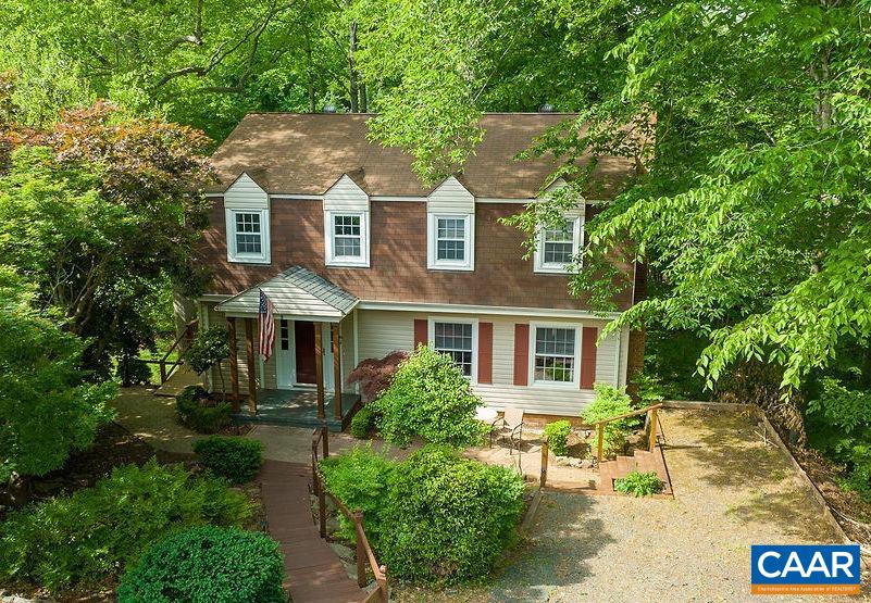 Nestled off a cul-de-sac in the leafy, residential community of Woodbrook on the north side of Charlottesville, this promising Dutch Colonial is an amazing opportunity for the next owner to bring their vision and create equity along the way. The large common spaces and wide back deck are perfect for entertaining. With four bedrooms upstairs and an additional bedroom, bonus room, and rec room in the basement, there is plenty of space for everyone to spread out. A beautiful wall of green behind the home provides privacy and there's a small brook at the rear of the property. Just minutes to Downtown, airport, NGIC, UVA, and a short walk to Woodbrook Elementary.