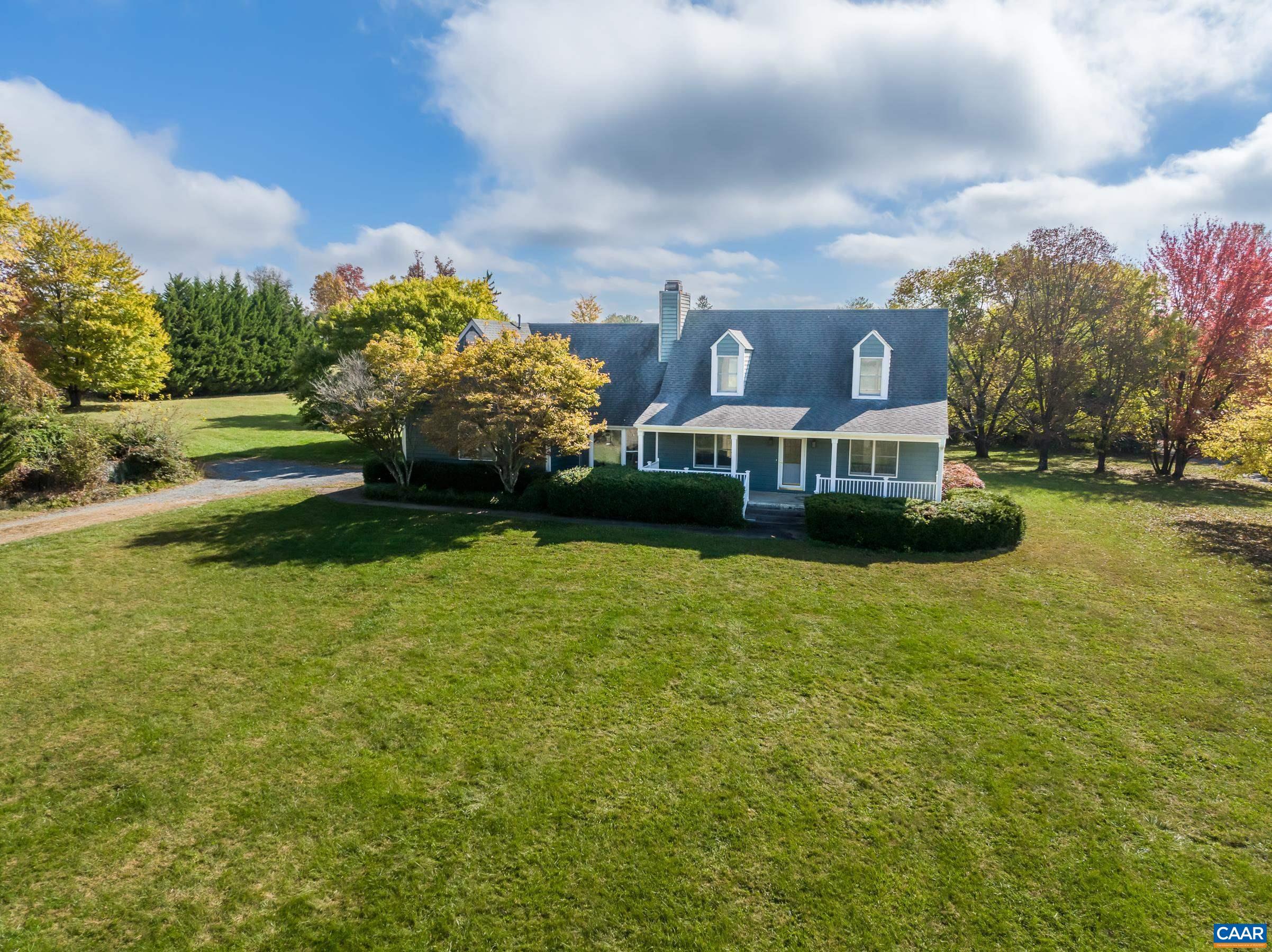 What a fantastic opportunity in desirable western Albemarle!  Don't miss the breathtaking, unobstructed, mountain and pastoral views from this charming cape-cod on 2+ acres in Greenwood! Located minutes from I-64, local wineries and antique shops.  This home has great bones but needs some love to finish some remaining projects. Spacious rooms, great yard, amazing views, and a location that allows you to update and upgrade without fear of over improving in this area.  Fresh paint and new luxury vinyl plank flooring throughout the main level. You'll love the brick, dual-sided fireplace in the living room and kitchen. Kitchen features lots of storage, large pantry, and bay window breakfast nook. Large, main level owner's suite with incredible views. Owner's bathroom is ready for you to customize and update.  Two large bedrooms and a home office/playroom on the upper level too! Enjoy the outdoors on the large screened porch and stargaze with almost no light-pollution! This home is being sold "as is" as it is an estate sale. No repairs to be made.