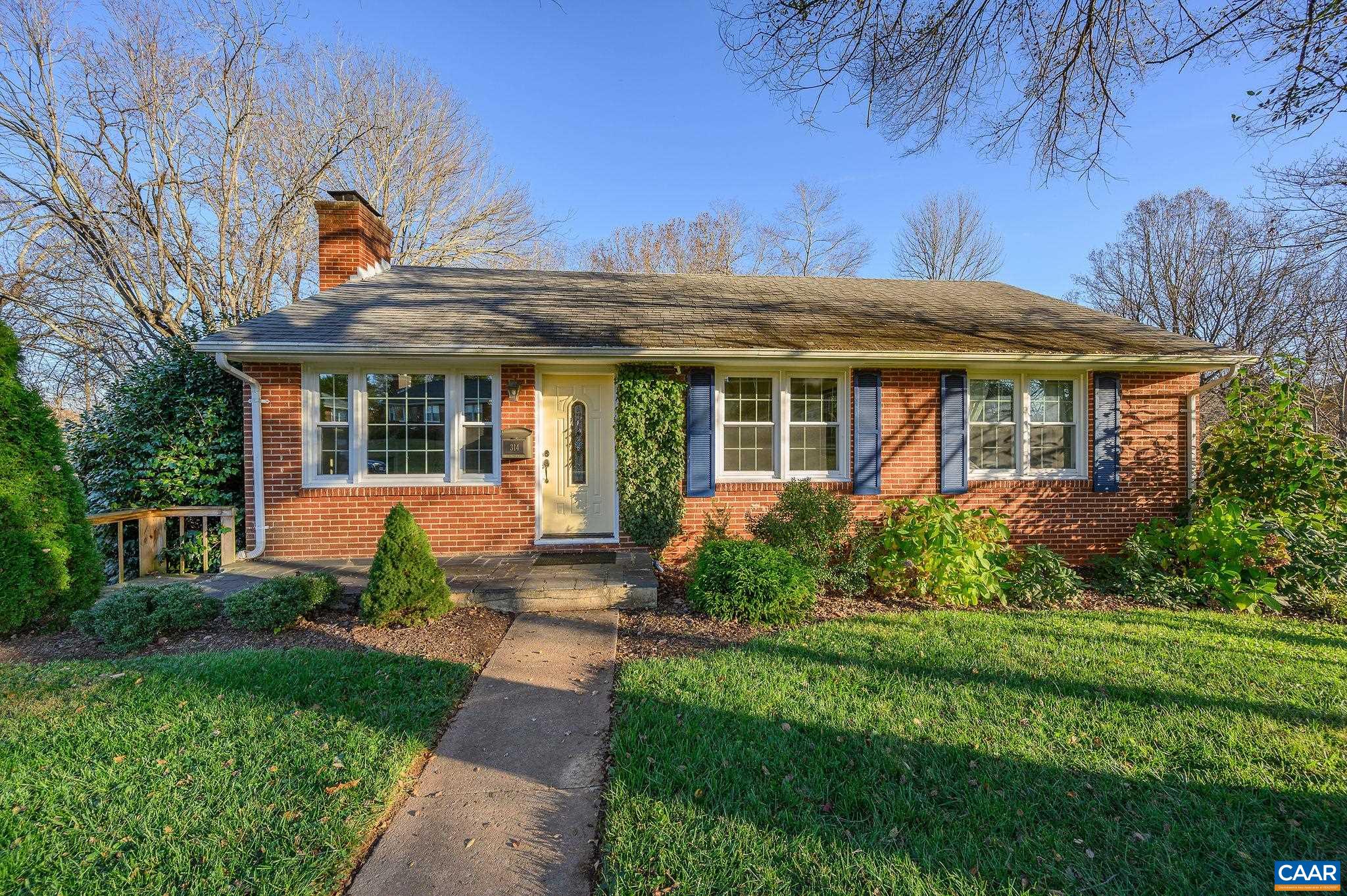 Quintessential Fry's Springs Charmer on FABULOUS .7 acre lot backing to Moore's Creek & Rivanna Trail wooded natural area. One of the BEST lots w/nature and privacy in the city! This 3 BR, 2 full bath home includes a RENOVATED kitchen w/subway tile backsplash/stainless appliances, original hardwood floors, kitchen/dining room combo, & wood-burning FP.  The walk-out FULLY RENOVATED terrace level has tons of light & windows w/ a 2nd living room, & 2 additional rooms with many possibilities. In fact, creating a sweet Airbnb would be simple to do on the terrace level! Outdoor living options include- expansive rear deck overlooking mature hardwoods, patio space & extended yard by the river--this serene area is a private oasis. Newer windows throughout. New HVAC in 2019. Walk to Fry's Springs, Downtown Mall, 5th St Station, Azalea Park & Rivanna Trail access.