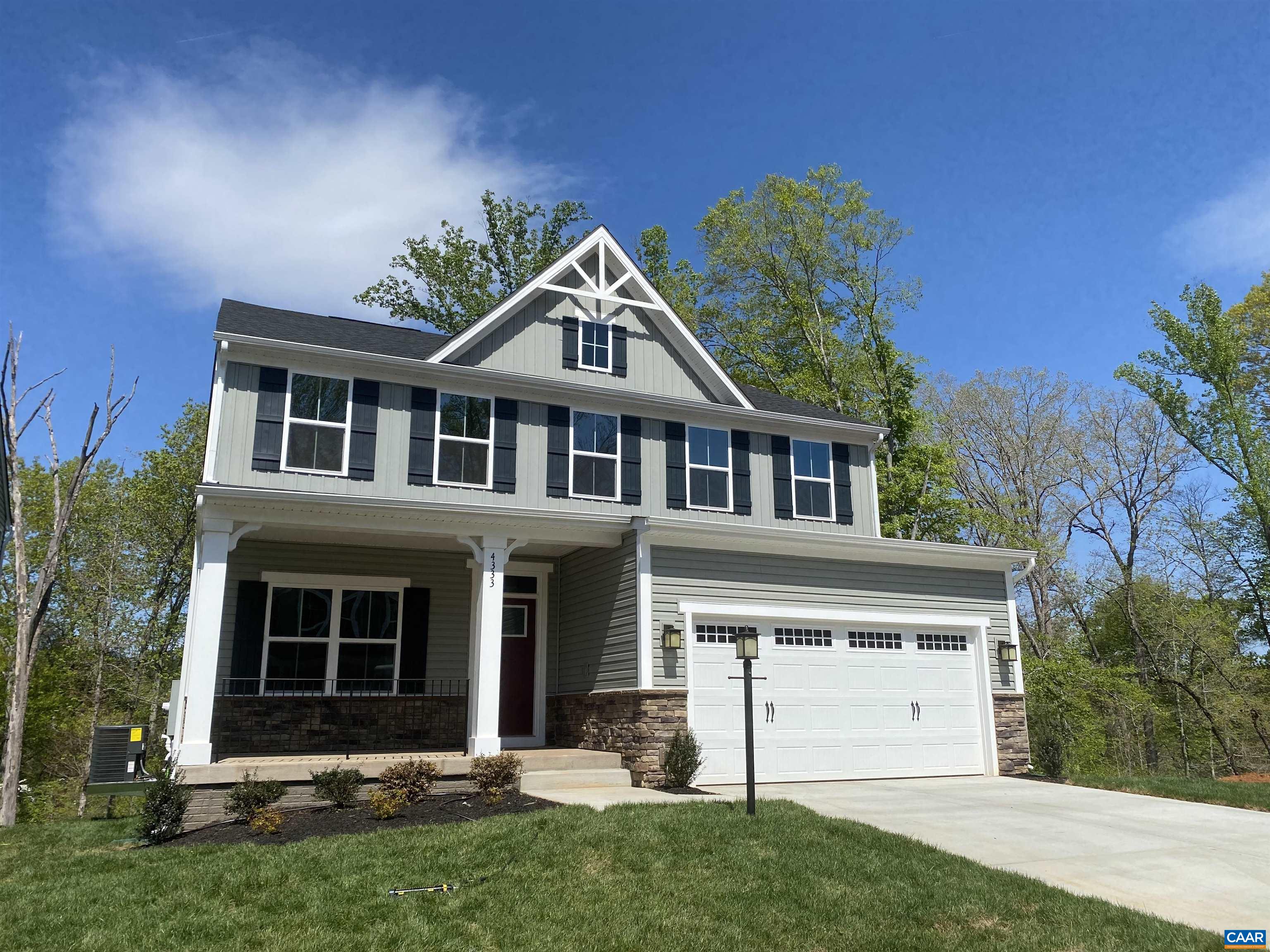 Finished in April of 2022 with no occupants. For the buyer who qualifies, a 30 year loan of 520K may be assumable at a fixed interest rate of 3.75%. 55K IN UPGRADES, Open-concept design with five spacious bedrooms, including a large owner's suite with a private bath, walk-in closet, a private basement bedroom, and full bath. Plus an OPEN kitchen with a large island, soft close cherry slate cabinets, granite counters, tile backsplash, large single bowl sink, bronze fixtures, and stainless appliances. This home also offers a home office, wide plank hardwood flooring throughout the foyer, kitchen, dining, and great room, gas fireplace, full finished walkout basement, a full front porch with stone exterior, covered rear porch overlooking the breathtaking mountain and river views, and a two car garage. This home is located just a short walk away from the brand new community park and walking trail to the Rivanna River and is also only 10 minutes from Hollymead Shopping Center.