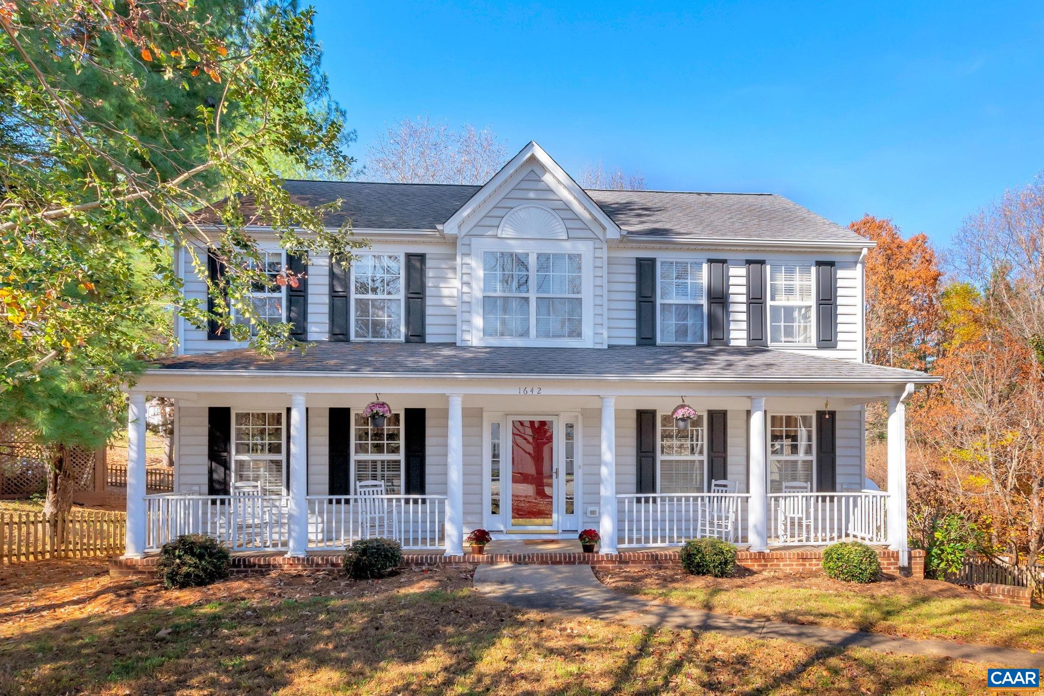 OPEN SUNDAY FROM 11am-1pm. A charming front porch welcomes you to this spacious floorplan in the conveniently located Raintree neighborhood. Hardwood floors run throughout the main level, which offers a nice combination of connectivity and defined spaces. Enjoy entertaining in the formal dining and living rooms off of the foyer complemented by an open kitchen with updated butcher block island and family room featuring a gas fireplace. Walk out onto the deck overlooking the fully fenced yard. Four bedrooms upstairs including a primary bedroom with ensuite featuring new soaker tub, full hall bathroom, and side-by-side laundry. The rec room with walkout in the basement provides flexible space and the two car garage adds to the abundant storage in the home.