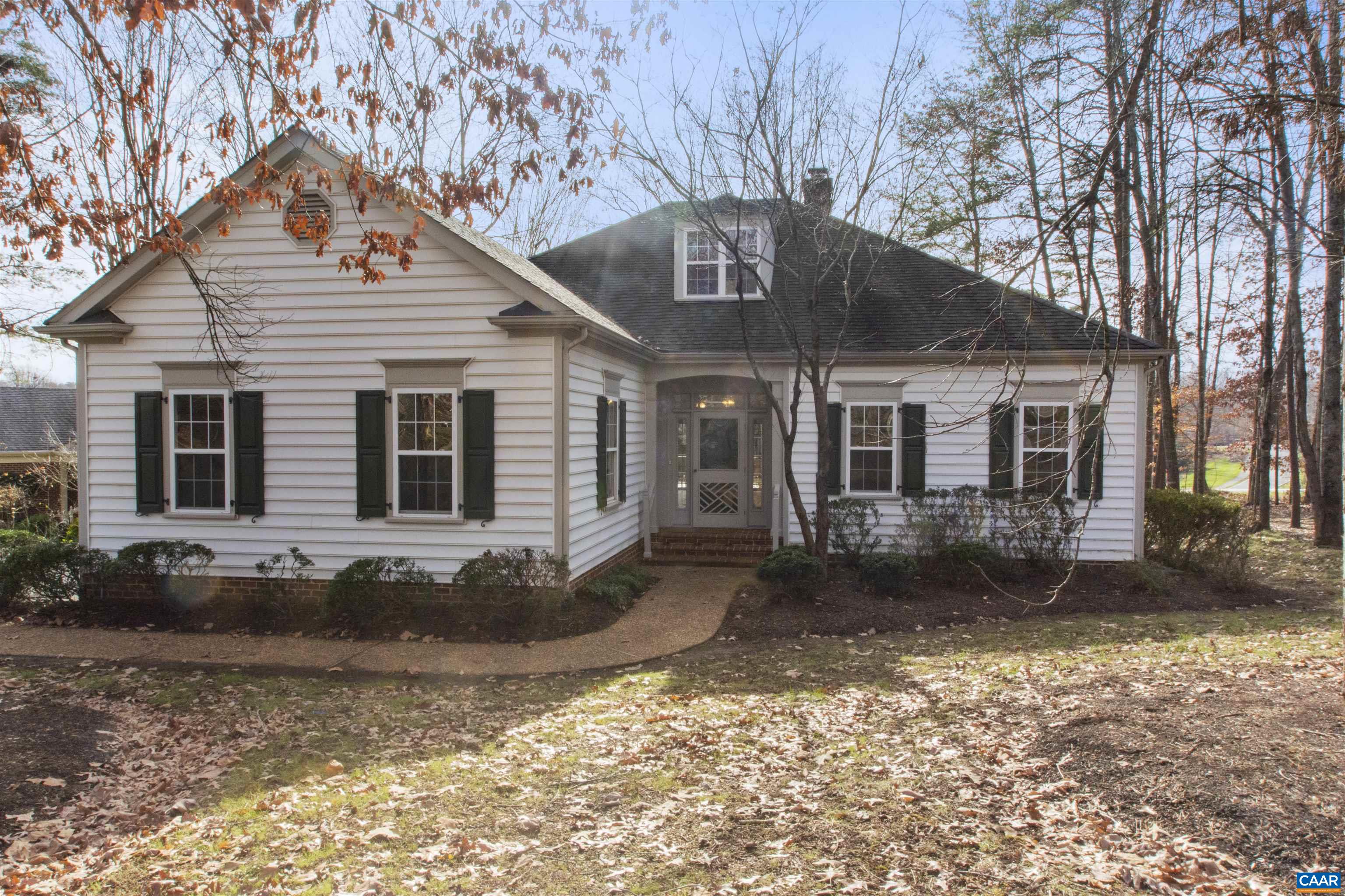 Gorgeous cottage residence on Glenmore's 6th hole surrounded by a beautiful grove of mature trees.  This lot is just the right distance from the green, offering a gorgeous view while still being private, safe and protected.  With a main level primary suite, gorgeous hardwoods in the main living areas and plentiful windows - this one is bright and airy.  The family room fireplace, centrally located, creates a warm and comfortable family space.  This cottage is the perfect size, and it has additional floored attic storage as well.  Come enjoy all that Glenmore has to offer beginning with your own personal retreat!  The HOA includes EXTERIOR LAWN MAINTENANCE!