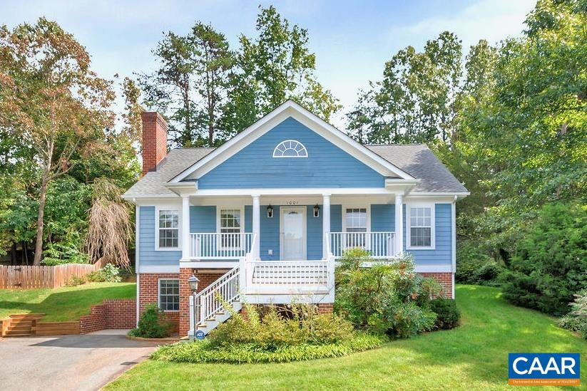 Charming sun filled Redfields home with covered front porch,  soaring vaulted ceilings and finished basement.   Beautiful red oak flooring, wood burning fireplace with stone hearth,  large kitchen with tons of counter space, granite countertops, tile backsplash and island.  Owners suite has a large walk in closet and private bath with ceramic tile shower.   Finished basement has an oversized family room with second wood burning fireplace , fourth bedroom with full bath perfect for visiting family or private guest suite.  Community amenities include pool, playground, nature trails and lake.  Minutes from UVA, I-64, downtown Charlottesville and 5th Street Station shopping.
