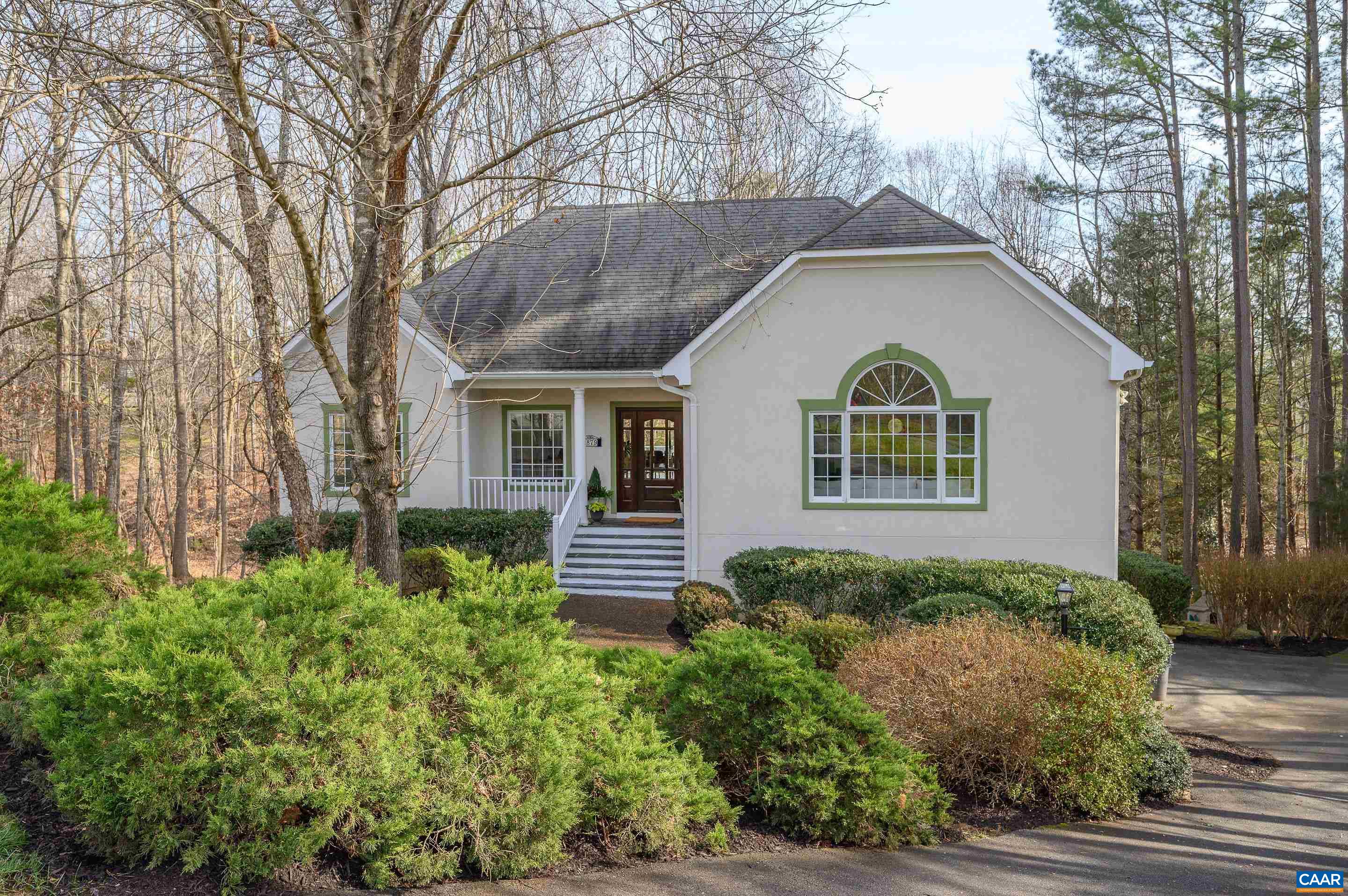 Located east of town less than 10 minutes to the city of Charlottesville with easy access to I64 in the gated Glenmore community this home is a stunner!  Flooded with natural light the floor plan blends traditional architectural features with a modern floorplan where one room flows into the other.  The first floor includes a large great room with gas fireplace, vaulted dining room, renovated kitchen with family room and private breakfast nook.  Also located on the first floor is a large primary suite with beautifully renovated attached bath with deep stand alone soaking tub, walk-in tiled shower and double vanity.  Three bedrooms, two full baths and a recreation room that opens to a large patio are located on the terrace level.  A large deck with private wooded view is accessed off the main living areas and primary bedroom allowing for a peaceful outdoor entertaining spot.  Recent improvements include a renovated primary bath and terrace level bath, full interior paint, refinished hardwood floors and new HPUMP and Gas Furnace.