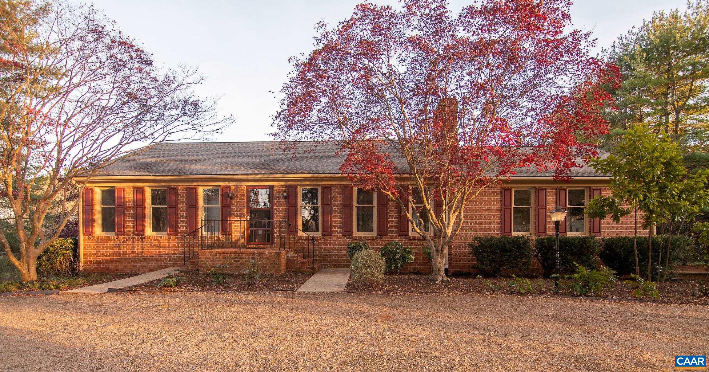 FIRST TIME ON MARKET & GREAT LOCATION!  Well built brick rancher sitting on 2 professionally landscaped acres just minutes from Charlottesville.  Enjoy the quiet and privacy in your large back yard, while inside there is a wonderful great room with a wet bar and built-in sound system for entertaining.  A beautiful living room with a fire place greets you when you walk in the front door, connecting to a formal dining room.  Hardwood floors and crown molding throughout the living areas give this place a special feel.  The kitchen, two large bedrooms and two full baths complete the main level, while in the walkout  basement there is a third large bedroom with a full bath, finished laundry area, and a 2 Car garage.