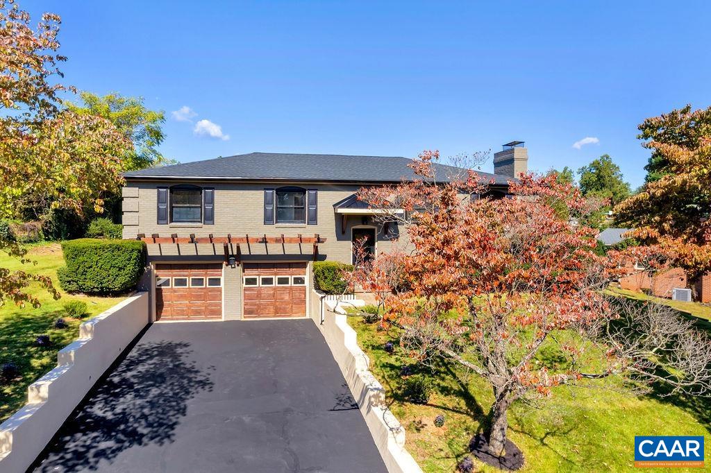 Open House 1/22 1-4 pm. Beautifully renovated Canterbury Hills charmer is wonderfully convenient to UVA, downtown or shopping & features gorgeous commons areas, high end finishes & great outdoor spaces. Step into the open concept living, kitchen & dining room area with its gleaming hardwood floors & gas fireplace. The kitchen sparkles with granite countertops, an oversized island, tile backsplash & new stainless appliances. French double doors lead onto the patio & overlook an enormous partially fenced back yard, perfect for gardening, play or entertaining. Down the hall one finds a full bath with tile plus four bedrooms including the primary suite w/ shiplap detail & walk in shower. Downstairs is a generous recreational space with wood burning fireplace, half bath & dedicated laundry room as well as a 2 car garage.