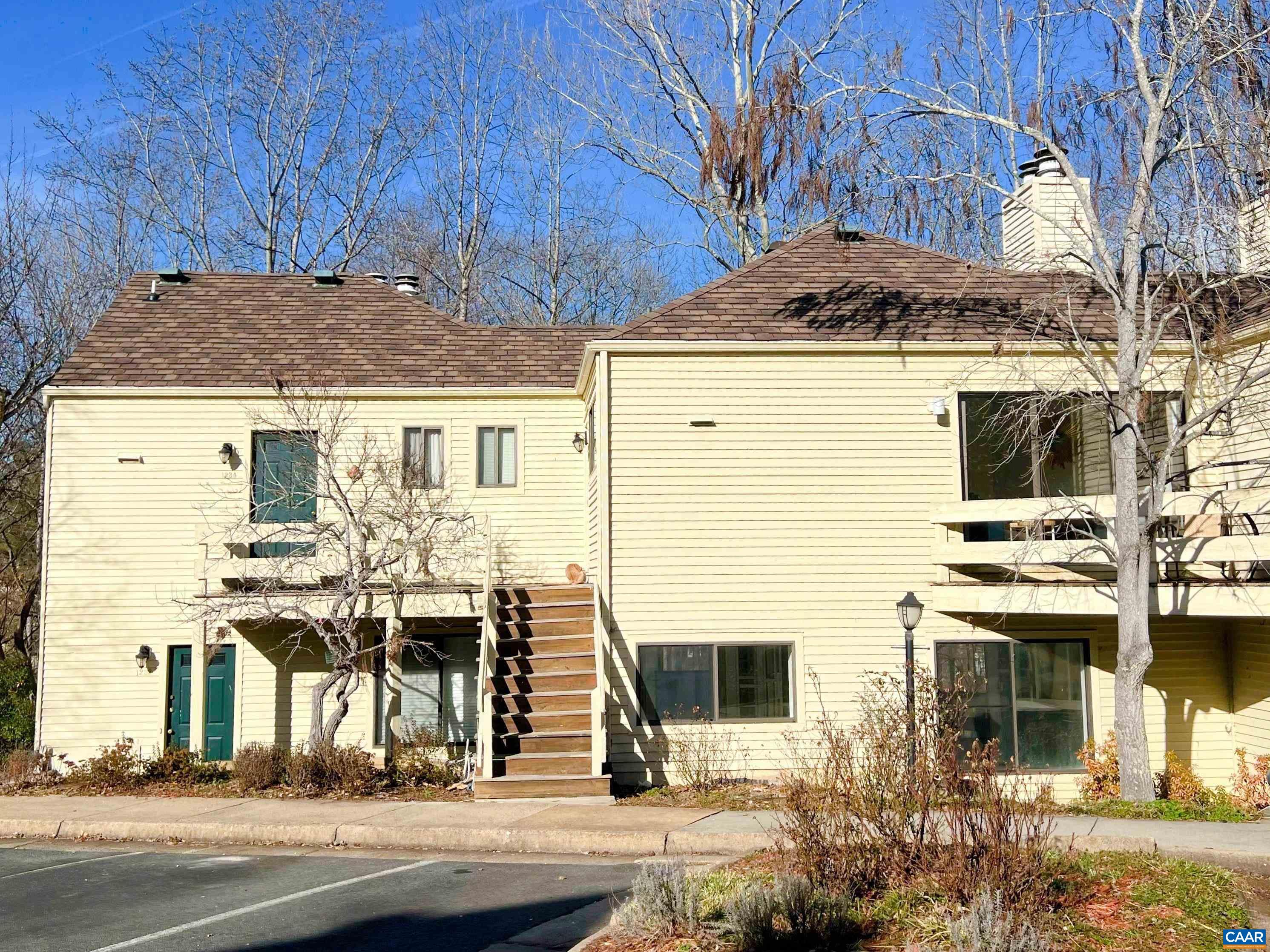 TOP FLOOR CONDO! Conveniently located in the "Chatham Ridge" neighborhood within River Run which offers private parking and quick access to Downtown, Rt. 29/250 and Pen Park (Golf, Tennis, Ball Fields, Playground and hiking trails).  River Run amenities include a Community Pool for residents.  You'll love the sun drenched rooms, pine floors on the diagonal (no carpet!), and vaulted ceiling. This unit has a new roof, new HVAC, stainless Appliances & granite in the Kitchen. Primary Suite can double as your office with built-in Granite Work Station; remote-controlled blinds convey. Storage available in the pull-down Attic. Sliding doors with privacy blinds to balcony allow sun during the day and privacy at night. Cozy up with the  wood-burning fireplace and watch your favorite movie - TV included. No short term rentals permitted - minimum lease is 12 months.