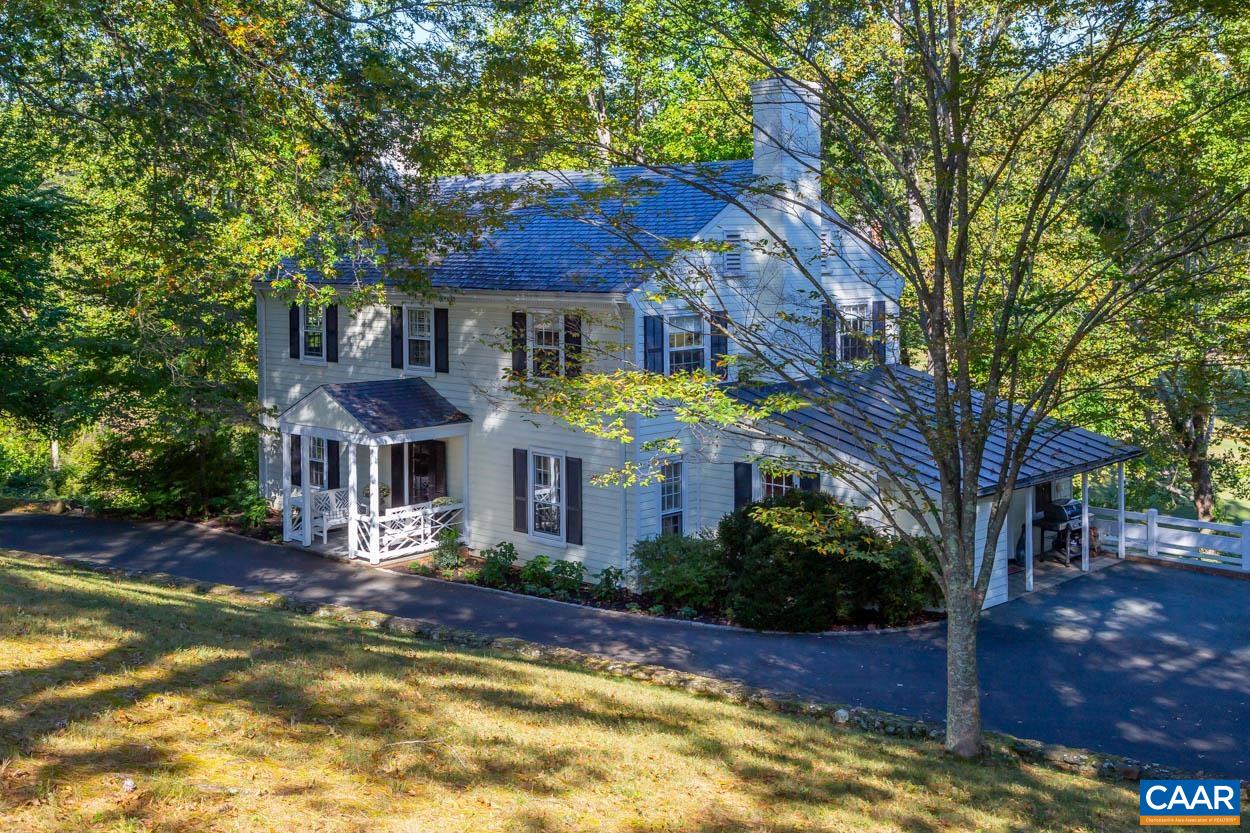 One of the last homes in Farmington under $2M with tremendous upside potential. Traditional, colonial-style clapboard home, circa 1966, slate roof, well maintained, very spacious, numerous recent upgrades, and privately situated in the Farmington Country Club, just West of Charlottesville. This lovely home has a beautiful sun room across the back with a great view looking down on the new executive golf course at Farmington and lake on the third hole of the East course. The home has many wonderful living spaces including large living room with fireplace, spacious sunroom, formal dining room, renovated kitchen, family room with fireplace, four bedrooms on second level, including master suite, and large terrace level that could be an apartment, containing rec. room w/ fireplace, kitchenette, fifth bedroom and a full bath, plus storage. Seller has architectural drawings for multiple addition options including a garage, large main level master, detached suite, etc. Priced $250,000 below assessed value.