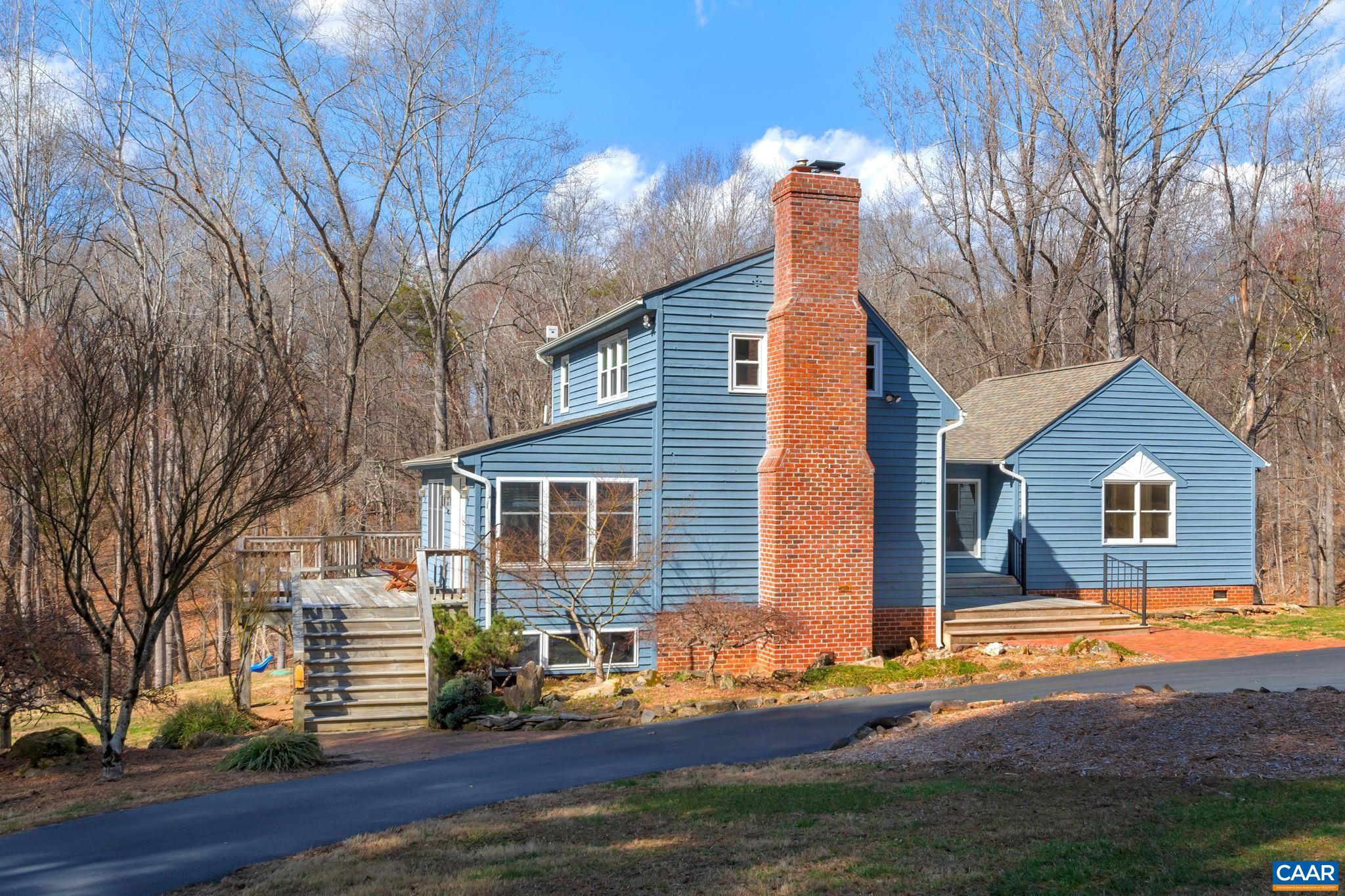 Serene country living in Advance Mills,  Northern Albemarle County. This attractive custom-built home includes 3 Bedrooms & 3 full baths in a unique layout courtesy of the numerous additions and renovations carried out since its origins in 1983. The Heart (and warmth) of the home is its beautiful Natural Stone Fireplace situated in the living room of the original structure. Years Later as needs changed, a wing incl. 2 bedrooms and a 3rd full bath was added in '96. Outdoor living spaces multiplied too W/ decks on 3 sides of the home now. The 5 acre parcel is mostly open w/ grassy lawn & ornamental gardens. You'll also find mature hardwood forest in the backyard which includes a Traversing Stream w/ adjacent Fire Pit sitting area. The many bulbs and other perennials are getting ready for their Spring Reveal.  Come for a visit and tour.