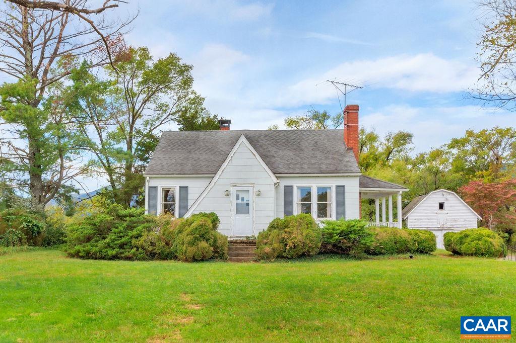A charming cottage in need of a complete renovation. This property is a "project", but worthy of a restoration. hardwood floors, fireplace, side porch and detached garage are a few features. Stone retaining walls, English boxwoods and other plantings surround the home.
