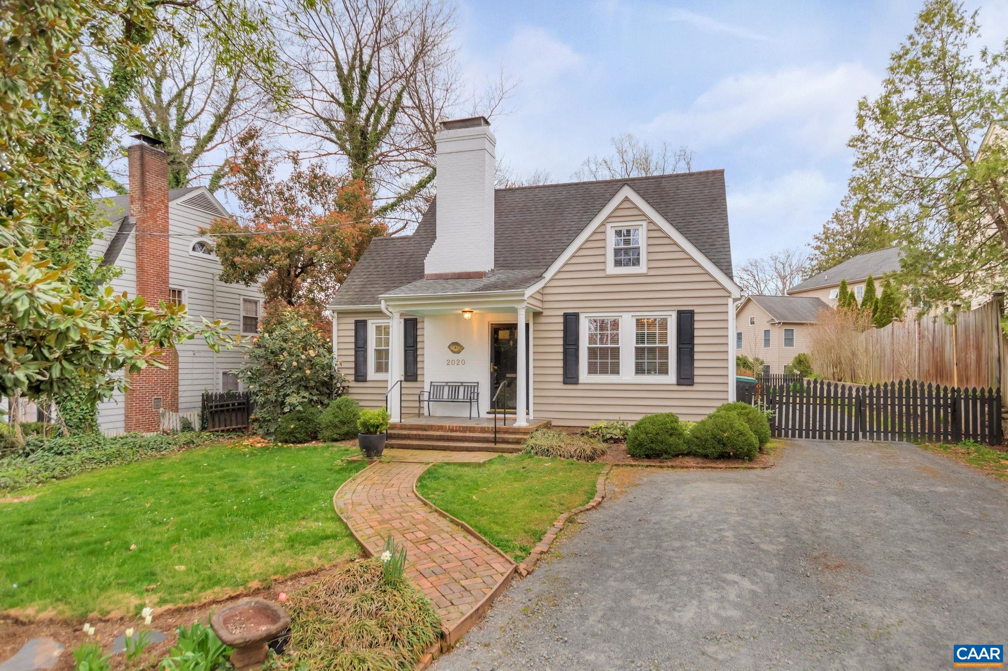 OPEN SUN 10-12! Curb appeal abounds in this RENOVATED 3BR/2BA COTTAGE nestled in the heart of the desirable LEWIS MOUNTAIN neighborhood along the 10Miler course steps from UVA + Downtown Charlottesville. A charming brick pathway beneath the stunning magnolia tree leads from ABUNDANT PARKING in the driveway to the inviting covered porch. Cozy up by the fireplace in the serene living room where natural light streams in from new windows + an arched doorway frames the bright dining room. The REMODELED KITCHEN boasts smart design, new stainless appliances, classic white cabinets + honed granite counters adjacent to a fantastic MUDROOM feat. skylight, laundry + tons of cabinet storage. A FIRST FLOOR BEDROOM SUITE completes the main level. Upstairs are two character-rich bedrooms + tiled full bathroom. Excellent outdoor living space on a SCREENED PORCH overlooking the beautiful backyard with footbridge + gardens! An outdoor shower is icing on the cake. Come see for yourself!