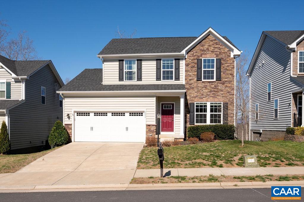 With a view of the Rivanna River and the western mountain range, you won't want to miss this 2018 Riverwood home in Northern Albemarle. Entering the foyer you will find the living room to the right. The large open family room, dining area, and kitchen span the rear of the home where you can take in the peaceful serenity of the wooded view and enjoy total privacy. Also on the first floor are a convenient laundry room just inside the garage and a half bath. 4 bedrooms up, including a huge primary suite make for a straightforward floorplan. The basement level is mostly finished with high ceilings and the possibility of many different uses, including rec room or home office. Multiple storage areas and a rough in for Full Bath as well. Don't miss the 2 car garage. HOA takes care of snow removal and trash. Easy access to NGIC, the airport, Hollymead towncenter and all northern wineries and other attractions. Additionally, two separate playgrounds are in close walking distance.