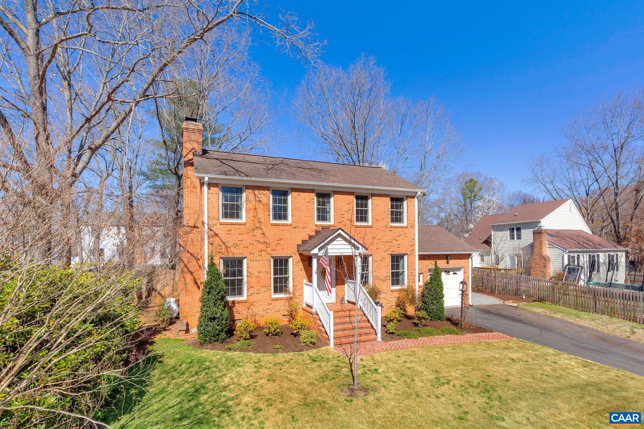 This classic brick home has been meticulously maintained and features a park-like backyard just minutes to downtown, UVa, fitness, shopping, restaurants, and more. The main level features multiple living spaces with a traditional family room with gas fireplace and a fantastic sunroom on the back of the house letting in tons of natural light. The flex room off the entry is currently used as a home office but could also function as formal dining. Spacious bedrooms upstairs include a master suite with en-suite renovated master bath. Gleaming hardwood floors run throughout the entire home - no carpet. Enjoy the outdoors on the brick patio or around the built-in fire pit in the backyard. The current owners love riding their bikes to the breweries and restaurants downtown and walking with their dog to the Rivanna Trail.