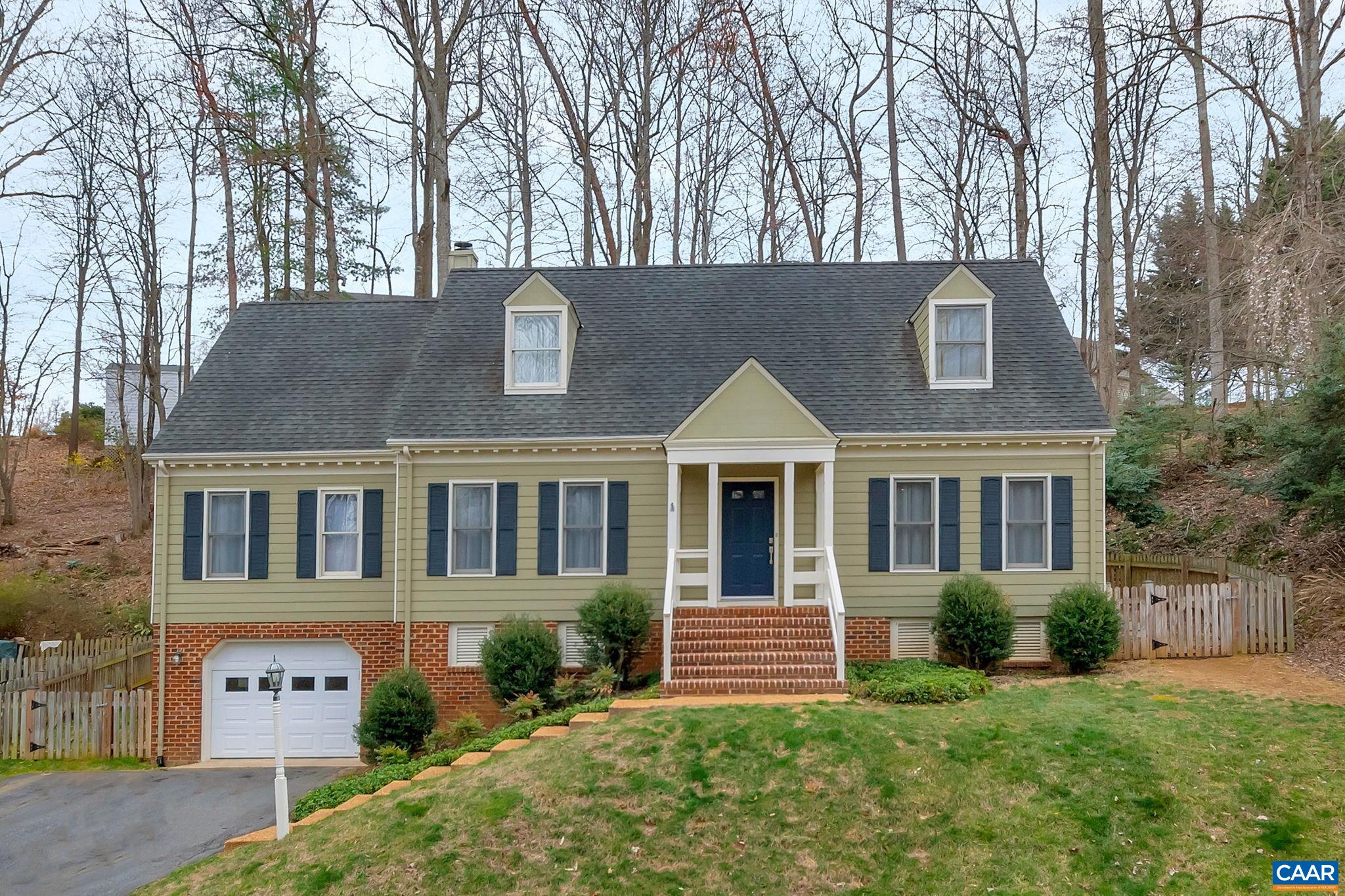 Classic Cape Cod style home with 4 bedrooms/2.5 baths in a quiet, mature neighborhood within minutes to downtown Charlottesville, UVA Grounds, NGIC,  and route 29 in general (grocery stores, gym, shopping, dining). This home can be lived in with 2 master bedroom quarters, one option being on the main level as an ensuite OR by using the larger bedroom on the second floor with attached bath. Special Features include : NEW AC unit (2022), NEW programmable garage door with keypad (2022), NEW master bath vanities with Quartz countertops and 3 color temp light fixtures (2022). You MUST see the well appointed Eurostyle kitchen and coffee bar with Quartz countertops that was designed for sleekness and functionality (2019). Each bedroom has a generously sized walk-in closet PLUS bedroom number 4 has the oversized walk-in attic storage.  6.5" wide engineered hardwood flooring runs throughout the main floor - except in the master bath - plus there is a wood burning fireplace in the family room that has a door outside to the fully fenced backyard and patio for dining alfresco. The basement level has laundry area, an expansion opportunity in the unfinished area and single car garage. TING fiber Internet is available in the neighborhood.