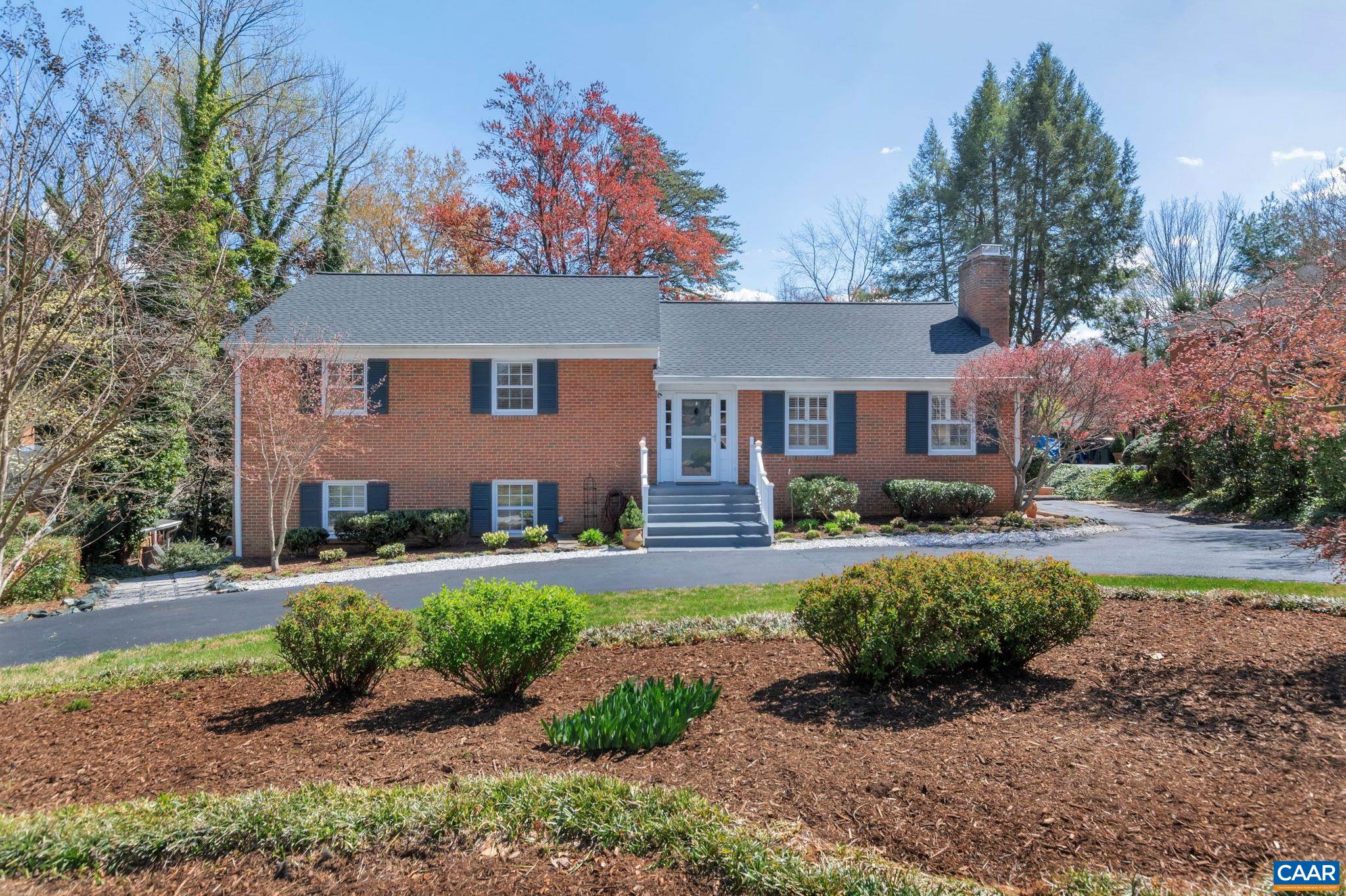This meticulously maintained, all brick home has been fully renovated and is one of the larger homes in highly desirable Canterbury Hills featuring substantially sized  living spaces and bedrooms, solid wood molding and trim, and two wood burning fireplaces. The house lives large providing comfortable spaces for everyone. Hard to beat this location just a stones throw from Barracks Road Shopping Center, UVA, Rt 250, downtown, etc. As you enter the front door on the main level you are greeted with a spacious, well-lit foyer, a grand family room, new hardwood floors, formal dining, a renovated kitchen with quartz counters, glass tile backsplash, and stainless appliances; and last but definitely not least, a fabulous sunroom on the back of the house that has been finished for year round living. The new hardwood floors continue upstairs where you will find the primary bedroom suite, two additional bedrooms, a hall bath with double vanity, and access to the walk-up attic partially floored for so much storage. Downstairs are two additional large bedrooms, a flex room that would make a great office or exercise room, laundry and another full bath. Beyond that is a massive rec room with a built in bar and outside access.