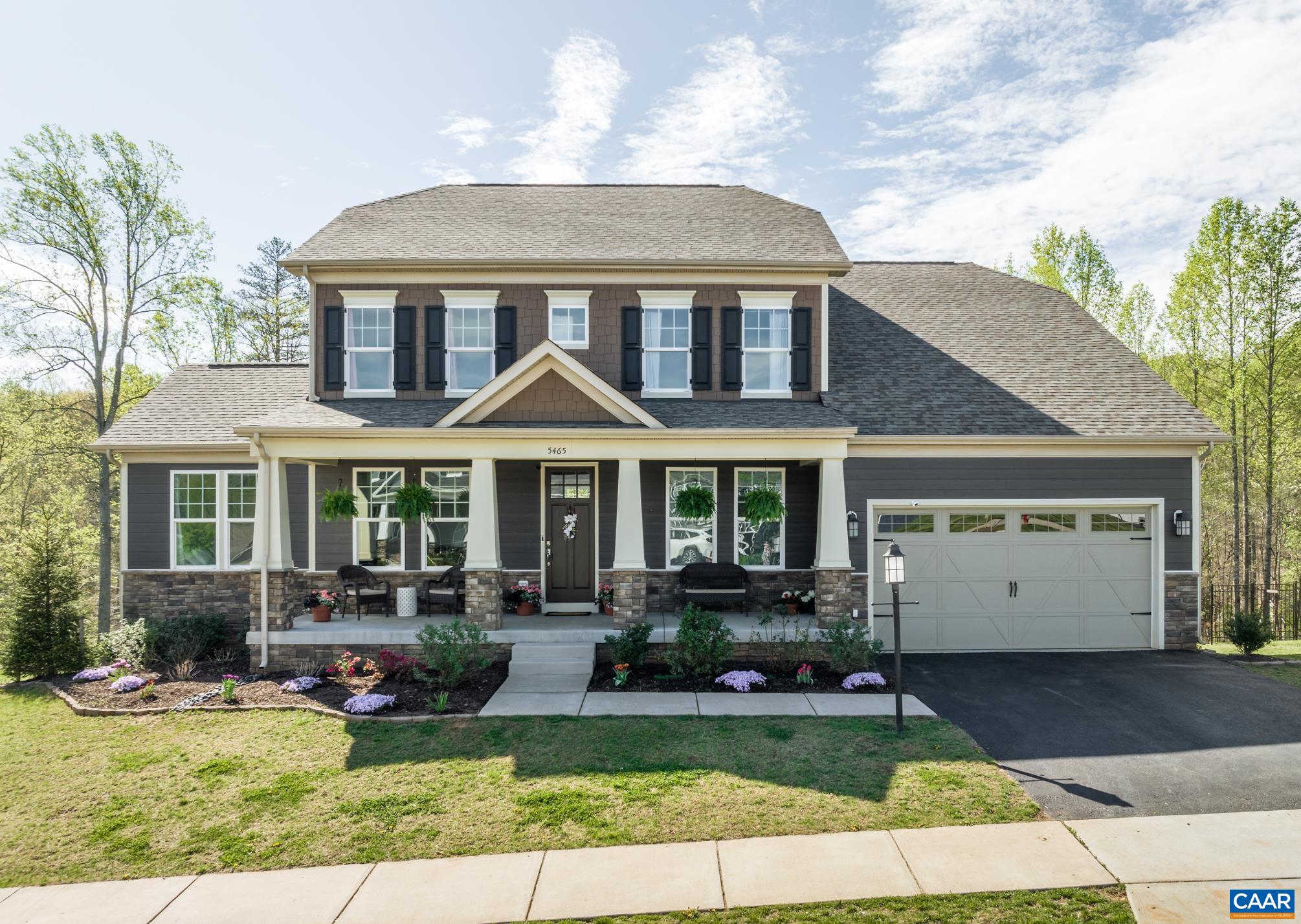 Gorgeous Crozet home BACKS TO WOODS & has direct access to Crozet Trails! WELCOMING FRONT PORCH leads to stunning, OPEN FLOOR PLAN w/ generously sized rooms including HOME OFC & GUEST SUITE on main level! Great room has gas fireplace, a woods view & opens to GOURMET CHEF'S KITCHEN. Granite is striking against the upgraded cabinetry. Walk-in pantry! Step out to SCREENED PORCH & DECK (Trex!) overlooking woods, FENCED BACK YARD and play area. ZERO CARPET! Engineered hardwoods below & matching LVP above. Take the stairs to upper foyer which leads thru double doors to a PALATIAL OWNER'S SUITE w/ lovely view of the yard & woods. Two large walk-in-closets! LAVISH BATH w/ granite, double sinks, soaking tub, and large tile shower.  Quite the home spa! Upstairs find three additional BRs, two w/ mountain views and one w/ woods view & ensuite bath. Need more space? Over 1600s of unfinished terrace space awaits your design for FUTURE EXPANSION! Rec room, home theater, gym or all of the above? Rough-in bath ready for full bath in future. Two walk-out doors lead to an OVERSIZED PATIO w/ yet another place to gather & stairs to deck and screened porch. Privacy & nature in bustling Crozet!
