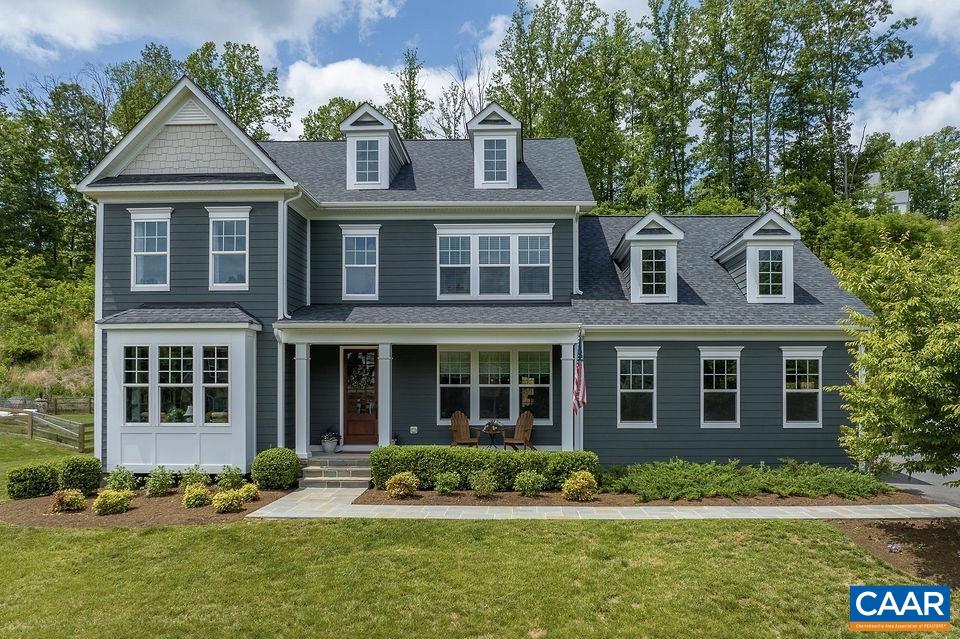 This exceptional 5 bedroom, 5.5 bath home in the Whittington subdivision is less than 10 minutes to UVA hospital, downtown, shopping, restaurants, w/easy access to 64.  Elegance abounds in this stunning home with an abundance of upgrades!  Hardwood throughout the first floor, open floor plan for entertaining, private library/office, informal and formal dining rooms, and a butler's pantry. The spacious first floor primary suite features a luxurious bath, complete with a walk-in closet! A chef’s dream kitchen offers exceptional cabinet space, some w/glass fronts, an island, gas cook top, wall oven and microwave, all stainless steel Electrolux appliances, a walk-in pantry and expansive countertop space!  First fl laundry rm with w/d hook up. Easy access to the maintenance free, spacious deck from the kitchen, for dining and relaxing in privacy. The basement level includes a large finished area, with outside access, a full bath and recreation room for watching tv, playing ping pong, and creating music or art, in addition to two large storage areas.  The second floor boasts a second laundry area, four additional bedrooms, 2 with en suite, all w/walk-in closets.  Outstanding storage space galore. A rare opportunity, not to be missed!