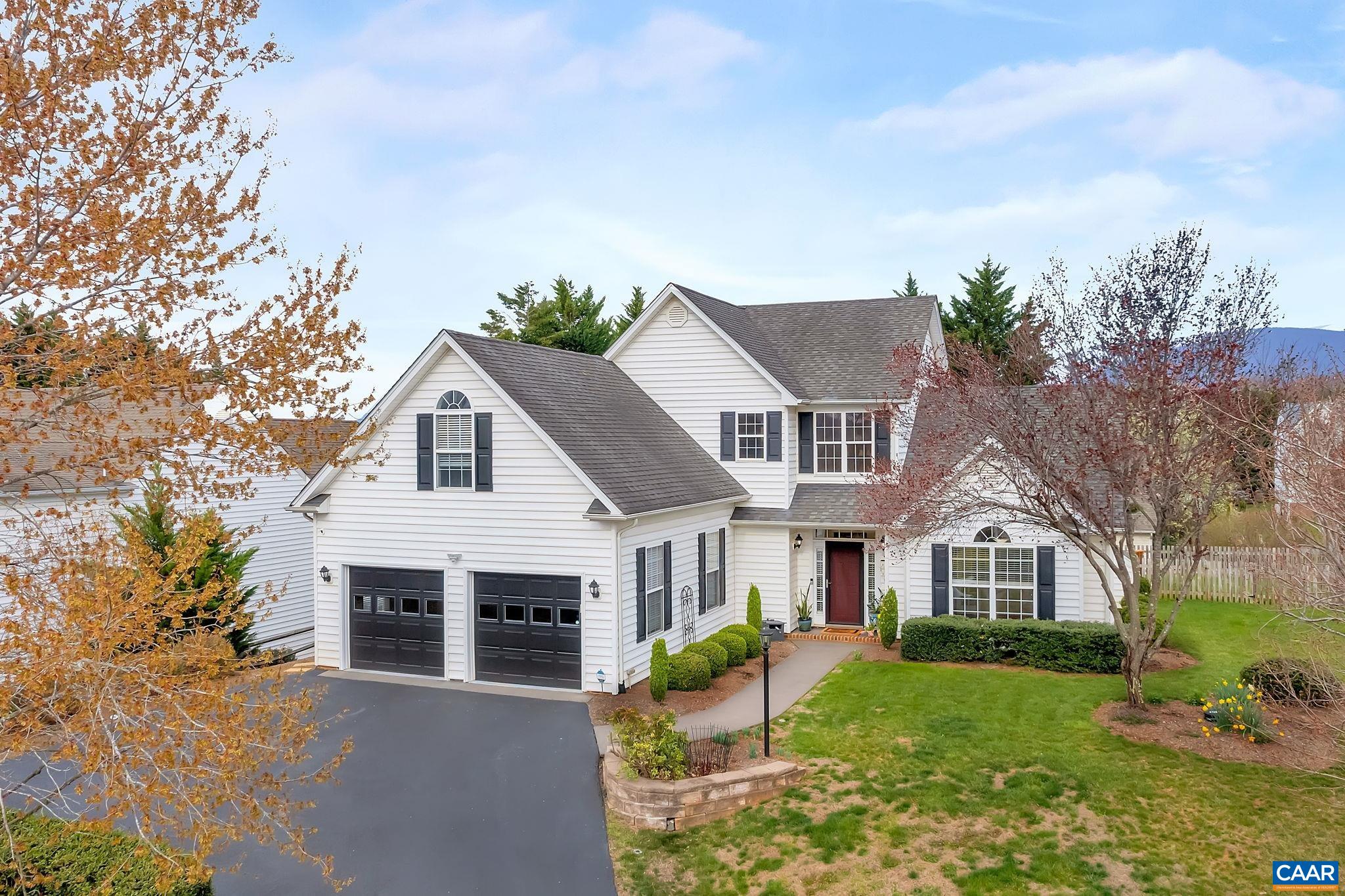 This spacious, single-family home in the desirable Western Ridge Community features both classic architecture and green living with an almost 9kW solar panel system (2021) on a cul-de-sac location. Welcoming 2 story foyer w/ split hardwood staircase. Off the foyer is both the living room (or office) and family room, each with french glass doors & glass transoms to close for a more private flow or keep open for a more connected flow. One level living offered with a first floor primary bedroom and spacious attached 5-piece ensuite & walk-in closet. The vaulted ceiling family room has a gas fireplace. The kitchen features a 5 burner gas stove, granite counters, subway backsplash, stainless Frigidaire appliances, pantry closet and a mixture of solid white and glass cabinet doors. Sunny eat-in kitchen dining area with amazing afternoon light. Dual zone HVAC systems BOTH one year old. The elevated position of the house offers a level fenced-in grass back yard with deck that overlooks the mature landscaping. Additional useful yard space on the side is not to be missed! Neighborhood amenities include: pool, playground, clubhouse, tennis, basketball, fitness rm & community trails connecting to Crozet.