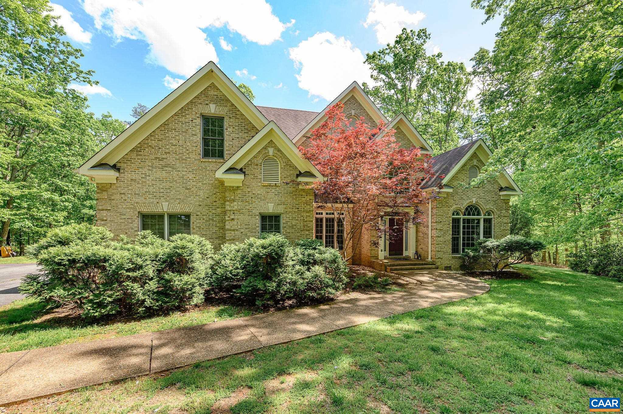 Located in desirable Turner Mountain, this home is nestled on 5 acres of peaceful woods & green space, in a quiet, private neighborhood. From the moment you enter, it's obvious that this was a custom-design build with every detail thoughtfully considered by the current owner. The two story Foyer flows to the Dining Room, Study & Living Room allowing for a wonderful, usable, yet distinctive flow. The first floor Primary Bedroom includes 2 walk-in closets, an impressive Primary Bath, & pocket doors to the Study. The open plan includes a comfortable connectivity of the Kitchen, Breakfast Room & Great Room (w/ a 2nd staircase to the upstairs). Right off of this area is an expansive deck (2 story!) which is both practical for grilling and allows for space to enjoy the backyard. Upstairs boasts another 3 BRs & a Bonus Room. Attentive details throughout the home include gorgeous hardwoods throughout 1st floor, moldings, vaulted ceilings, & 2 fireplaces w/ custom, hand-built mantles. Beautiful oversized windows allow for ample, natural light. There is an abundance of storage space w/walk-in attic. Updates: 1st fl flooring/HVAC, gas furnace. What a rare opportunity to live in a special neighborhood w/ privacy only minutes from C’ville.