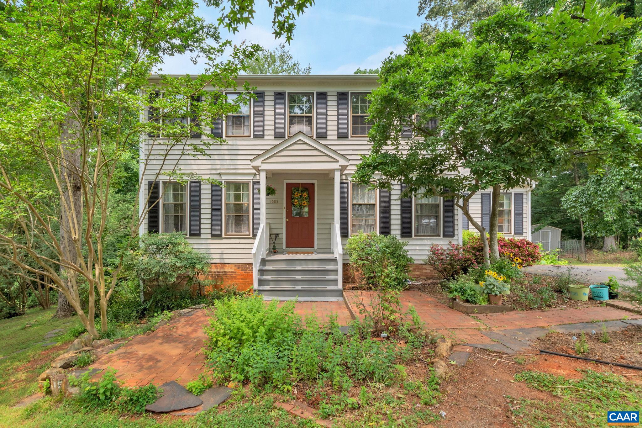 *PRICE IMPROVEMENT* to UNDER 500k for 3,356 finished square feet in for this charming colonial home in desirable Raintree community in Charlottesville! Located just off of Rte. 29, only 3 miles to The Shops at Stonefield & 5 miles to UVA & the historic Downtown Mall, this home offers convenience at its best! This sizeable 4 bedroom, 3.5 bath home boasts a traditional layout with both formal living & dining rooms, separate study, kitchen with island, & cozy family room with wood-burning fireplace. The second level features a large master bedroom with vaulted ceiling, & 3 additional well-sized bedrooms. Downstairs you’ll find an expansive walkout basement with finished rec room & full bath, custom built-in bar, & pool table- the perfect space for entertaining! Home is perfectly situated on over 1/4 acre on a CUL-DE-SAC backing to a PRIVATE, wooded neighborhood “buffer” space!