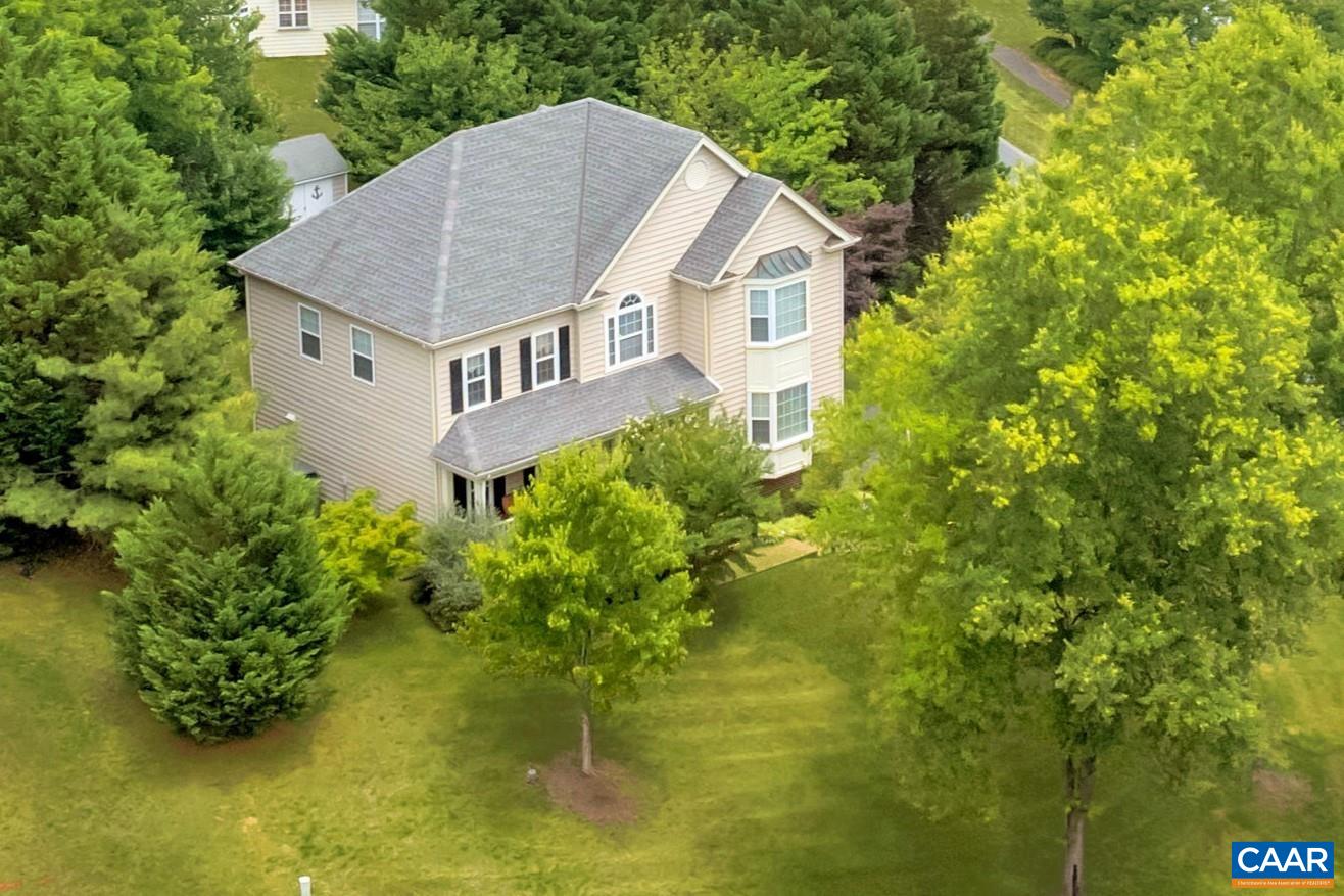 Enjoy sitting in on the charming front porch while taking in the picturesque views of Carter Mountain and beyond in this lovely home located in amenity rich Foxcroft. This 4 bedroom, 2.5 bath home has been lovingly maintained by thoughtful owners for many years. Upon entering, you will be greeted by a formal living room with a large bay window that capitalizes on the views, a separate dining room, and the entry into an open concept living space. A spacious family room seamlessly connects to the open kitchen with breakfast area. Newer doors lead to a comfortable back deck, and beyond the backyard is a shed for extra storage. Mature landscaping, a roof that is less than 10 years old and all appliances being included, make this an ideal home. The basement is move in ready, with the pool table and full-size refrigerator conveying. The oversized 2 car garage has plenty of additional storage. Enjoy a short walk to the community pool, clubhouse and playgrounds. Take a stroll on the walking trails while taking in the mountain views and enjoy the incredible convenience of the location in the heart of all things Charlottesville. Just a few short minutes to the downtown mall, 5th Street Station, UVA, IX Park and so much more!
