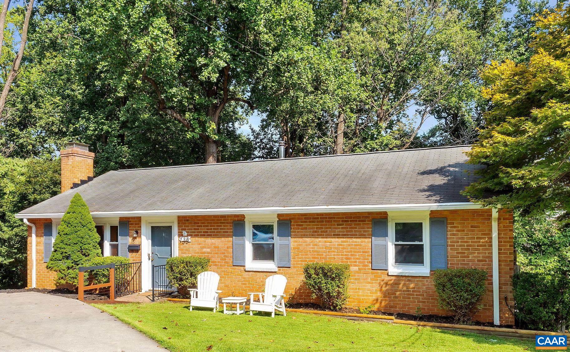 OPEN SUN 2-4 IN WALKABLE NORTH DOWNTOWN!  This bright 4 bed, 3 bath brick home w/ 2,344 sf is nestled at the end of a rare downtown CUL-DE-SAC w/ off-street parking.  IDEAL LOCATION, a mostly-level 17-mins walk along sidewalks to the vibrant Downtown Mall shops, restaurants, theaters + much more.  Inside, natural light pours into spacious living room w/ hardwoods, cozy fireplace. Open kitchen has been UPDATED w/ fresh paint, stainless appls, subway tile backsplash, granite counters + eat-in bar. Expansive DECK off dining room is perfect for add'l living/entertaining w/ an incredible TREEHOUSE FEEL overlooking the idyllic wooded OASIS down by the creek (inc. invisible fence). Upstairs, a primary bedroom w/ ensuite bathroom plus 2 more bedrooms + hall bath make ONE-LEVEL LIVING possible. A full, WALKOUT TERRACE LEVEL is icing on the cake, feat. an add'l bedroom, en suite bath, flexible rec room w/ wood stove, kitchen, laundry...SO MUCH POTENTIAL!