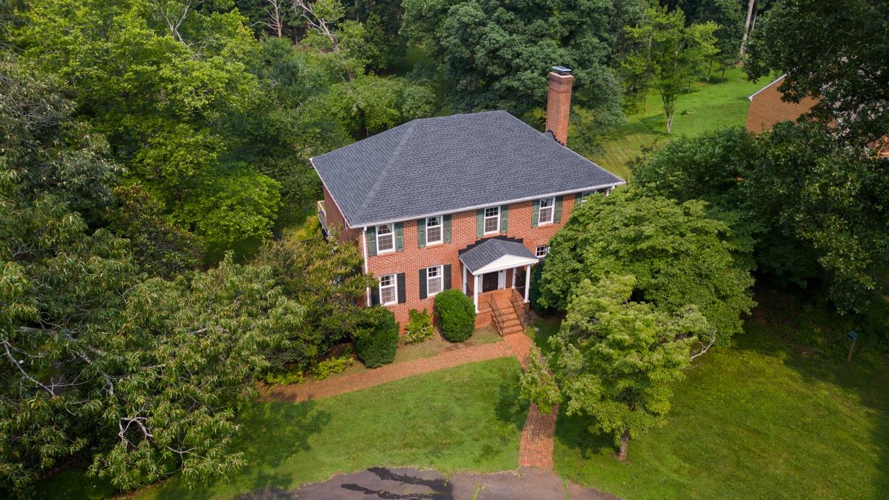Lovely traditional home located west of Charlottesville in Ivy Farms offering a peaceful and serene setting just minutes to Barracks Road. 200 square foot screened in porch with attached 12X12 deck situated on over 2.5 acres. Large owners suite with walk in closet, eat in kitchen, 2 car garage and work shop in basement with wood stove.