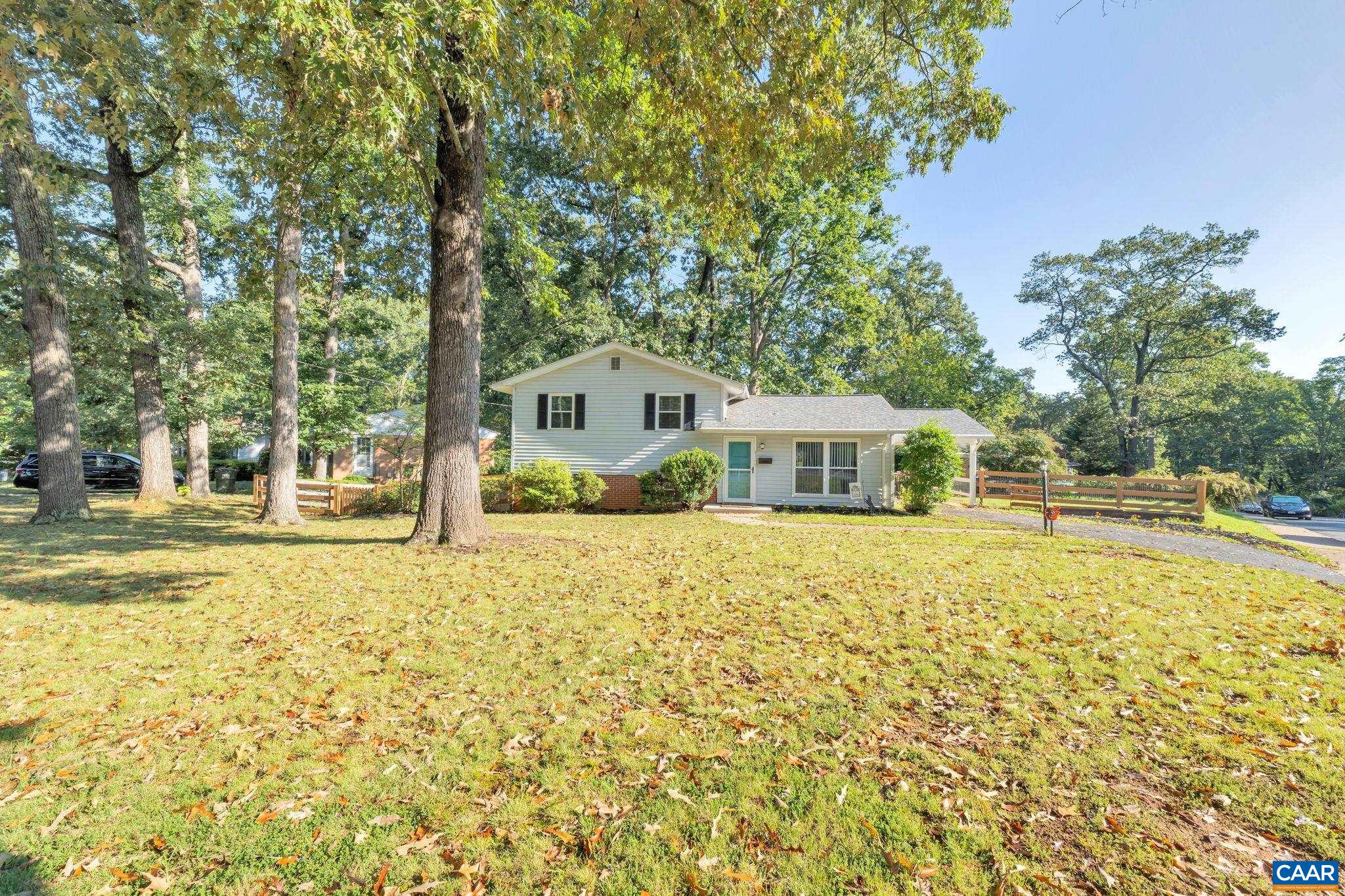 This fantastic home in Johnson Village was recently modernized with an open concept living space highlighting the fully remodeled kitchen, including custom cabinetry, stainless steel appliances, granite countertops, and plenty of seating. Real hardwood flooring was added and all of the hardwood on the main and upper levels is stained to match. The upper level bathroom, with close proximity to all three bedrooms, is fresh and spa-like with a new double vanity, ceramic tile flooring, modern shower tile, and a shiplap accent wall. A den, half bath, and laundry/storage area on the terrace level round out the interior space. The den is a perfect bonus area for watching TV, exercising, a playroom, and more. The outside spaces extend the living area and offer opportunities to dine, entertain, and relax. The home sits back on a corner lot with a large, flat front yard and a fully fenced backyard. The Johnson Village neighborhood has sidewalks throughout and is walkable to the local elementary school as well as Forest Hills Park. Just a short drive away are the Fry's Spring restaurants, Wegman's shopping center, UVA campus, and Downtown Mall. This home is close to everything the city has to offer within a lovely neighborhood setting.