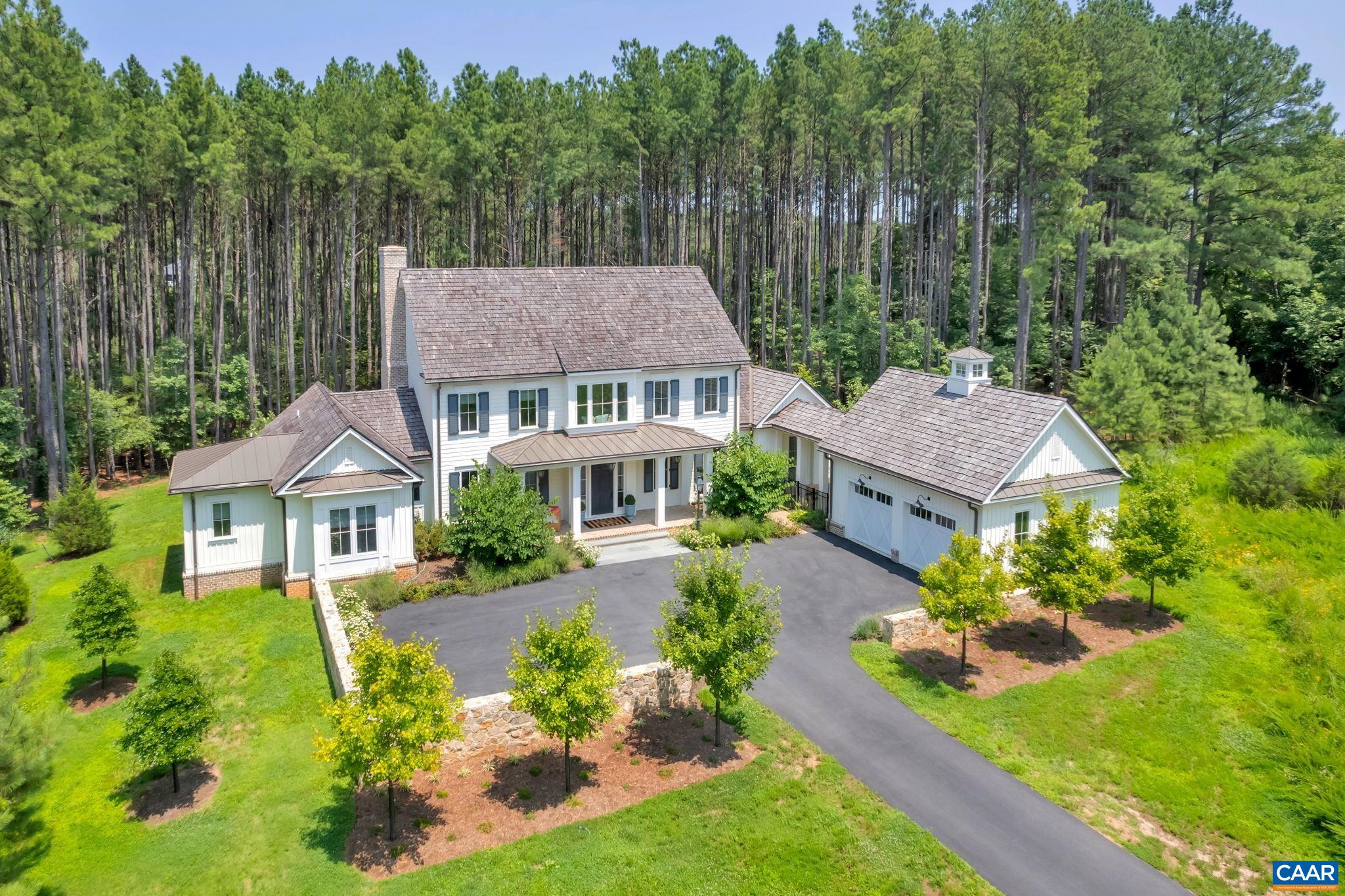 Luxury and Privacy in Keswick Estate // Custom home (C: 2021) with high quality craftsmanship, one level living and open concept is an absolute gem offering the perfect balance of traditional architecture and modern conveniences. You'll immediately notice the 10' ceilings and oodles of natural light. The home is located on a secluded lot with mature trees next to the Keswick Trails and a quick golf cart ride to the posh amenities of Keswick Club including "Full Cry" (Keswick's award winning golf course - #66 in Golf Week's Top 100), tennis, pool and Marigold restaurant.  Covered front and rear porches add to the charm and livability, plus the lush lawn is perfect for pets and play. Second floor offers a sitting area, Laundry room and 3 spacious BRs - all with baths en suite. Recent improvements include stunning light fixtures, custom paint & wallpaper, fenced backyard plus a snazzy beverage fridge with ice for mixing smoothies and cocktails. You'll appreciate the fine finish details, and delight in the hidden pantry, spacious closets, cozy vestibules, laundry on two floors, and expansive storage. First floor home Office doubles as a Peloton room - you decide if it should become a formal dining room or cozy lounge. Don't miss out!