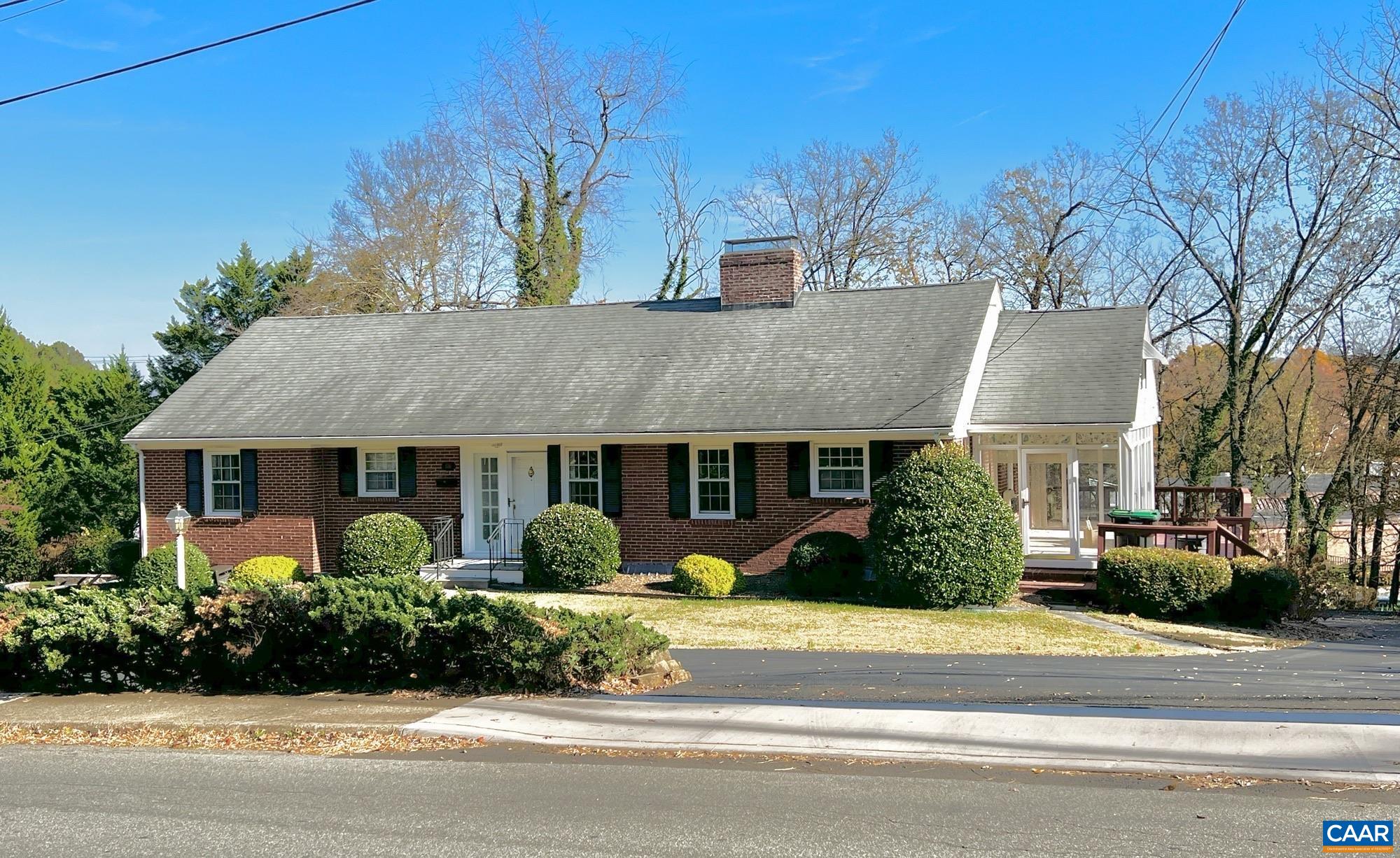 Start your new year in a new home! UPDATED convenient Dairy Road Living - walk to Whole Foods from this freshly painted roomy main level of this 3 bedroom brick ranch home with over 3,300 square feet on 1/3 acre. Welcoming circular drive, living room with a wall of windows, fireplace, sunroom, kitchen with knotty pine cabinets and large deck overlooking private back yard. Terrace level has tons of windows, large family room with fireplace, full kitchen, additional bed and bath, laundry, multiple workshop spaces and tons of storage. NEW heat pump and full attic includes a pool table and storage.  Income potential with separate metered 1-bedroom terrace apartment or easily connect to the main house with a small removation to reclaim the space. Flat back yard is private with endless possibilities.