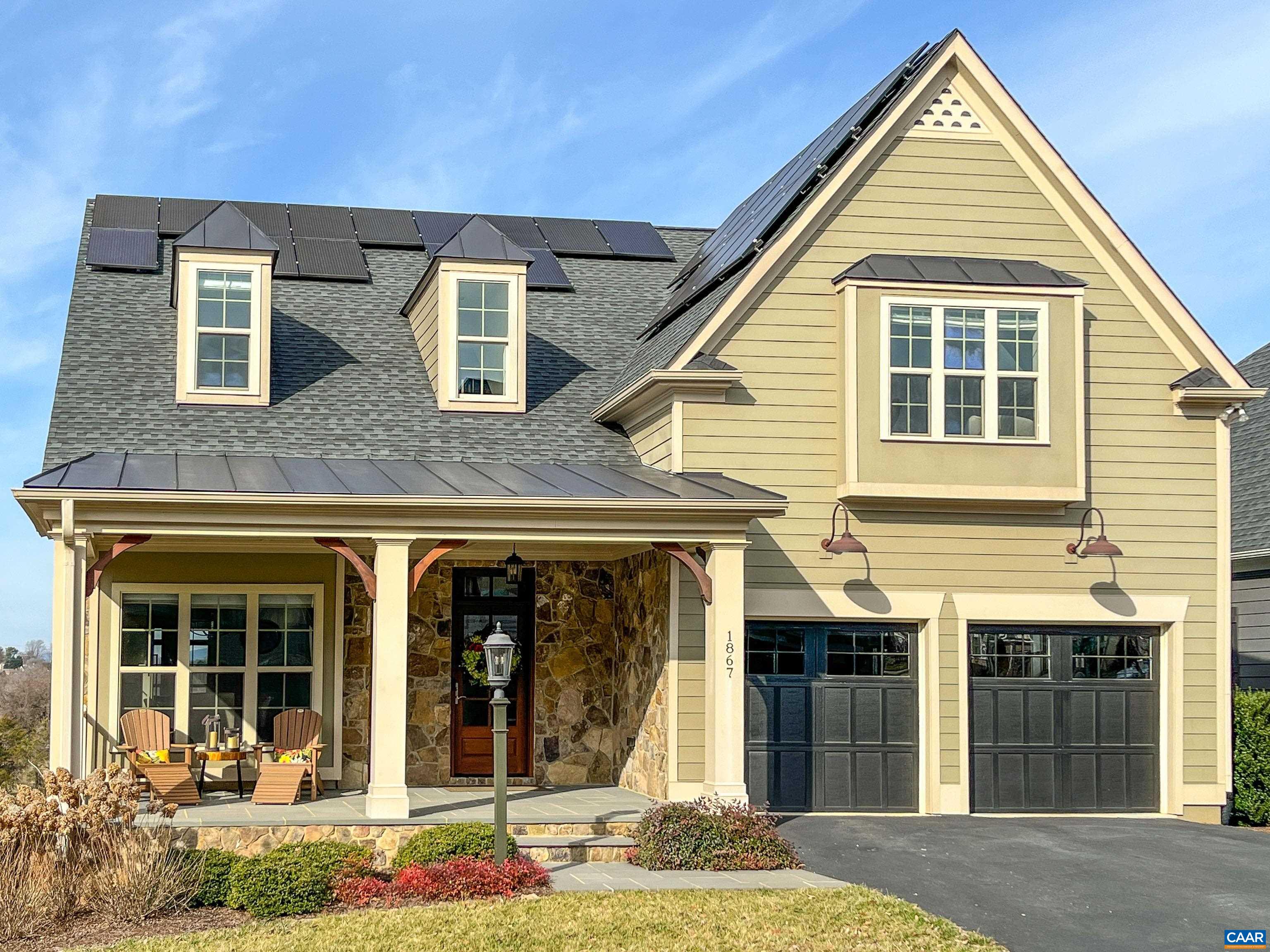 Enjoy beautiful sunsets and mountain views from all the living spaces. This home looks over the community pond out toward Darden Towe Park and the Blue Ridge Mtns thru a vaulted wall of windows in the Great Room. There is remarkable privacy here --there are no homes behind this one & all the homes are built to avoid any neighbor looking into the windows of another. A custom extension to the back side of this home puts the sun deck & screened porch into a protected nook w/no view of neighbors. Beautiful custom kitchen has a large island w/induction cooktop, custom cabinetry with pull out pantry panels that increase storage. Living area has a 2 sided glass fireplace that you can enjoy inside and out on the deck. Main level OBR suite has direct access to the sun deck, custom walk-in closet, bath w/heated floors, custom steam shower, & water closet. With laundry located in the mud room/butler's pantry, one level living is possible here. Lower level has huge living space w/modern gas fireplace, sunroom, Kitchenette (could be full kitchen), 5th bedroom, a full bath, & a workshop. Full array of solar panels on roof, whole house generator; 2 car garage has 50amp outlet for an electric car charging port. Just 10 mins to the downtown mall.