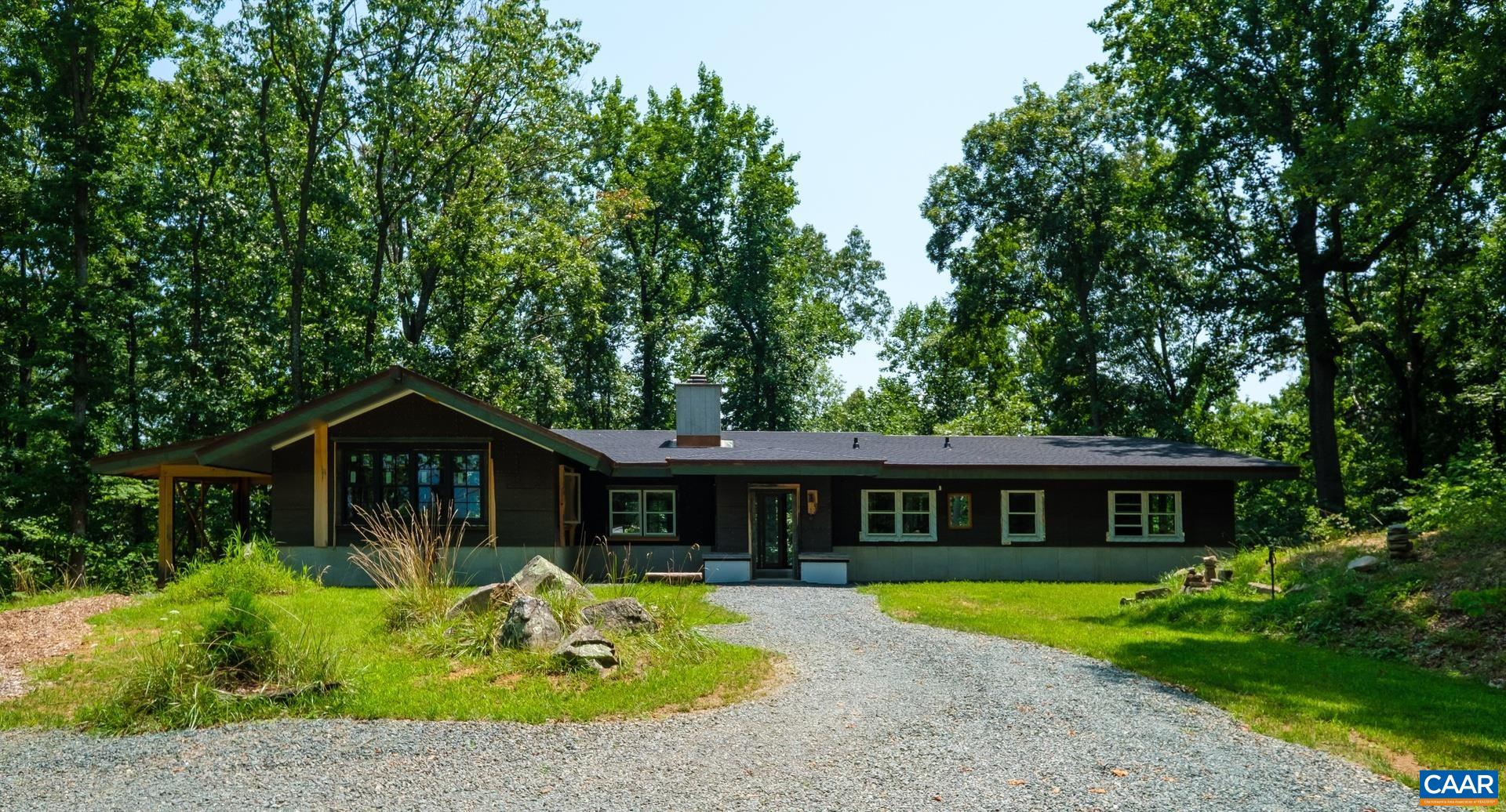 Once in a lifetime opportunity to own this pristine & wild property. An artist-designed & built dream home, just needs your style choices to finish! 114 acre private mountaintop estate in Free Union, just 30 minutes from Cville. Homesite planned in harmony w/ the land to maximize light in the winter, while the elegant modern roofline blocks the sun in the summer. Leaves fall in autumn to reveal 270 degree views from Monticello to Shenandoah Natl Park. The air is different up here, 10+ degrees cooler in the summer, warmed by thermal breezes off the south face in the winter. Surrounded by hardwood forest that hasn't been logged in a century, miles of trails and natural splendor, wildlife, natural springs, & pond. Work & permits done: mile long driveway, well & septic, concrete walls & elevated slab w/radiant floor heating, 6" exterior walls, under roof, pro landscaping. Open plan w/36x40' great room w/fireplace, soaring ceilings & endless windows, 1st floor primary BR. Basement: 10' ceilings, wood stove, 3 beds/bath. Live the authentic green dream with efficient passive solar design, off-grid ready w/propane systems and a gravity fed cistern.  Pure Magic!