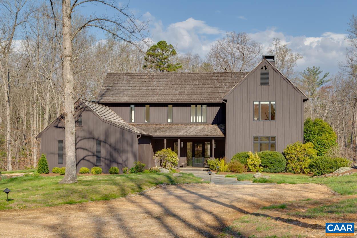 Elegant Free Union farmhouse, custom built by Shelter Assoc. & beautifully sited on a manicured 5-acre parcel.  The home is perfectly designed to capture natural light & the dramatic views of the surrounding pastoral setting. Located just 15 minutes from town, in the sought-after Ivy Elementary district, this home features sophisticated architectural details, high ceilings, walls of windows & an open floor plan centered around the charming farmhouse kitchen & great room with stone fireplace. The formal dining room, huge living room and office/study provide the enduring benefit of traditional gathering spaces with a contemporary feel throughout. All 4 bedrooms are upstairs including a dedicated guest room with ensuite bath and 2 generously sized guest rooms that share a jack & jill bath. The primary suite enjoys a spectacular winter mountain view and features a well-appointed ensuite bath and walk-in closet. The finished walkout basement with half bath is currently set up as a high-end home gym but offers potential flexibility for any number of uses. The home conveys with custom water treatment system, in ground irrigation with separate well, whole house generator and high capacity electric vehicle charger in the 2 car garage.