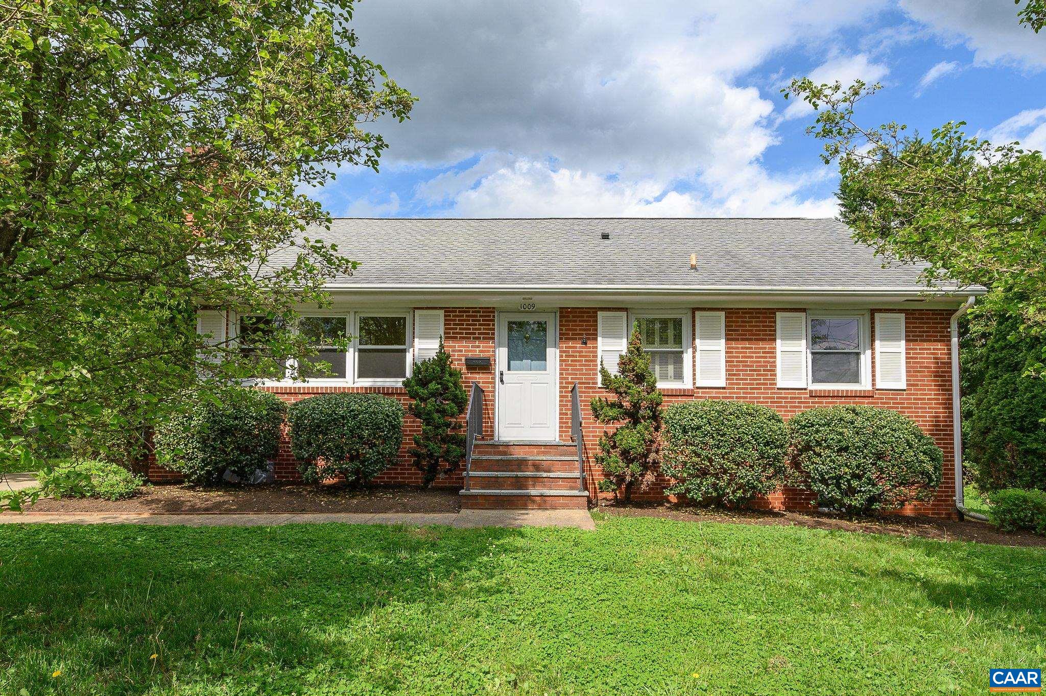Sweet, one-owner solid brick home in North Downtown. Sought-after level, landscaped, sunny lot with mountain views. Enter into the Living Room with gorgeous hardwoods that run throughout the main level. Enjoy woodburning fireplace in winter months. Bright-white kitchen with eat-in space that overlooks lovely backyard. Walk out basement with workshop, finished space & laundry. Walk up attic, already fully insulated- can be finished off as another bedroom, home office, etc. Newer replacement windows throughout.
