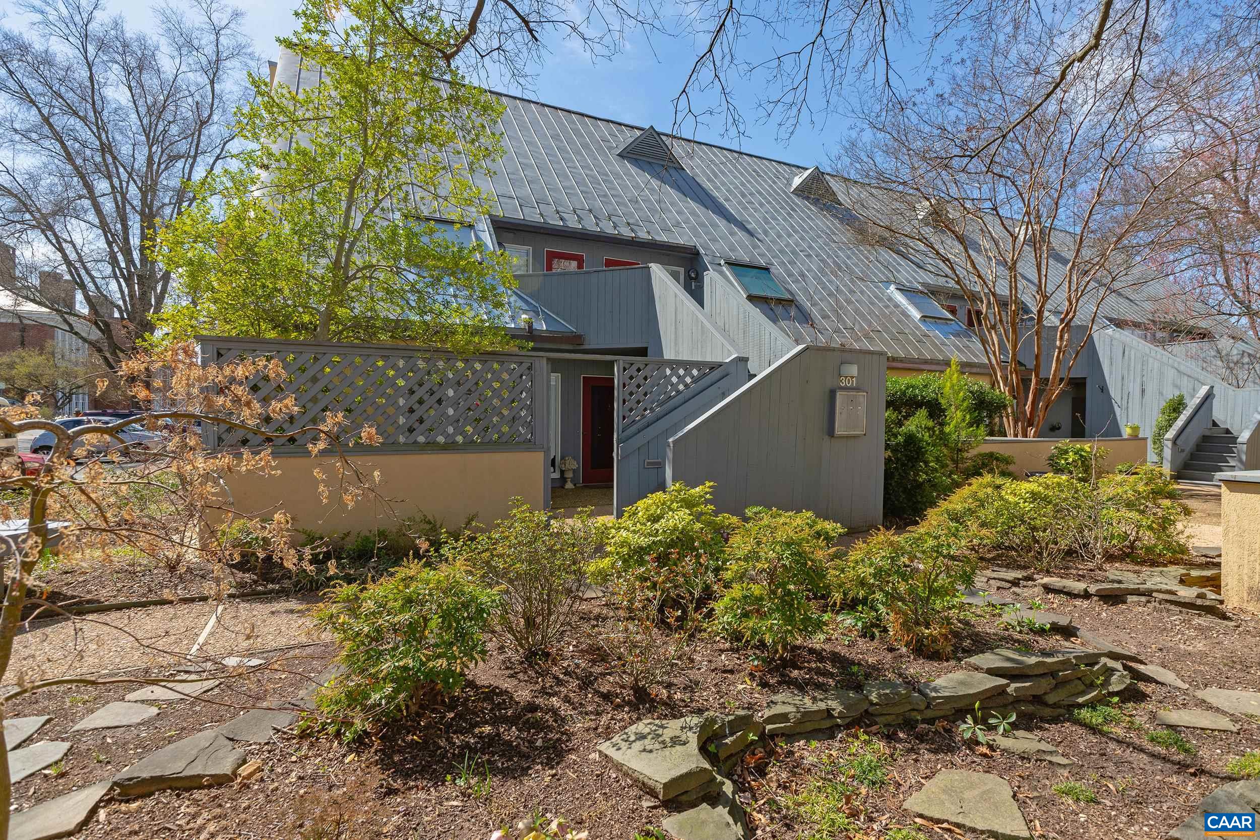 One level living in an outstanding location only two blocks from the Historic Downtown Mall of Charlottesville! This lovely condo has 2,171 finished square feet of living space, has been very well maintained, and includes: spacious rooms with an open floor concept; large glass windows bringing in plenty of natural light; kitchen with stainless steel appliances; huge living room with wood burning fireplace, large landscaped terrace off of the living room, two large bedrooms with two full remodeled bathrooms, ample sized closets, built-in bookshelves, and more! This south facing end-unit condo is located on the main level with no steps, directly behind McGuffey Park & the McGuffey Art Center, and is an easy walk to all of Downtown's top restaurants, galleries, theaters, shopping and more. Low maintenance, comfortable, downtown living at it's finest!