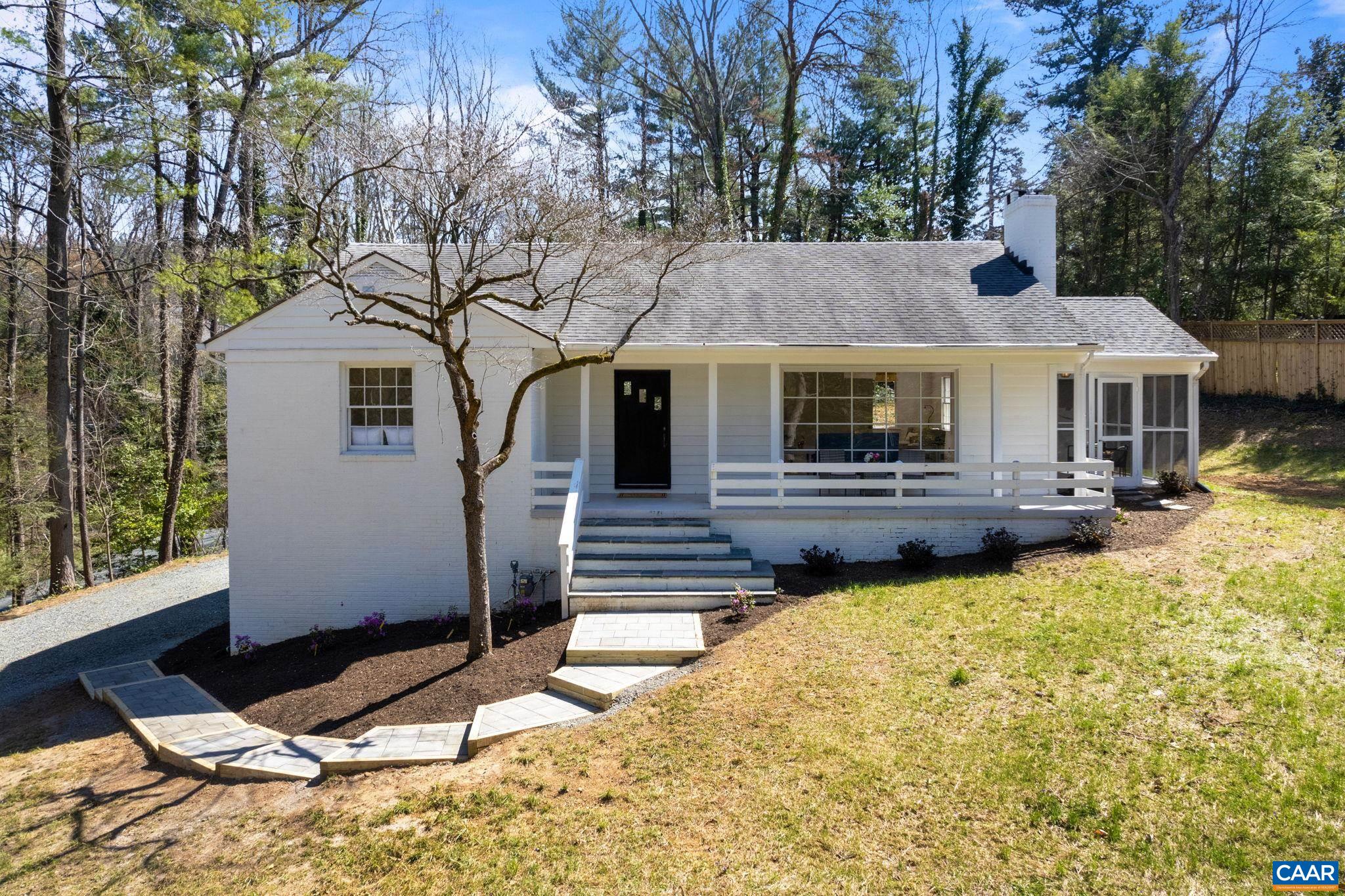 This MID-CENTURY MODERN Ranch home w/ terrace level on ALMOST ONE ACRE (.91) is a must see in the CITY OF CHARLOTTESVILLE.  And it’s located within a 5-MINUTE WALK TO BODO’S, Meadow Creek Gardens & the RTF Trail; & SO CLOSE TO UVA.  This COMPLETELY REMODELED HOME was a labor of love planned for many years of enjoyment but circumstances have changed. The Kitchen & Breakfast Area were redesigned for a more open floorplan. New Kraft kitchen cabinets, soapstone countertops & stainless-steel appliances w/ gas range have CREATED A DREAM KITCHEN. The PRIMARY BEDROOM WAS REDESIGNED ENSUITE w/ walk-in closet & BEAUTIFUL MASTER BATH, CARRERA MARBLE FLOOR, luxury shower w/ pebble floor & frameless glass enclosure, Pottery Barn double vanity & polished nickel fixtures. An INCREDIBLE 63 NEW RECESSED LIGHTS have been installed & are in every room of the house. Hardwood flooring has been added to the kitchen & all flooring has been refinished. The living room has a BEAUTIFUL PICTURE WINDOW looking out on the front porch & yard w/ trees creating privacy from the road. Bedrooms on terrace level were redesigned to add a full bath w/ natural stone & ceramic tiling & premium polished nickel fixtures. TOTAL PRIVACY but right in the heart of everything