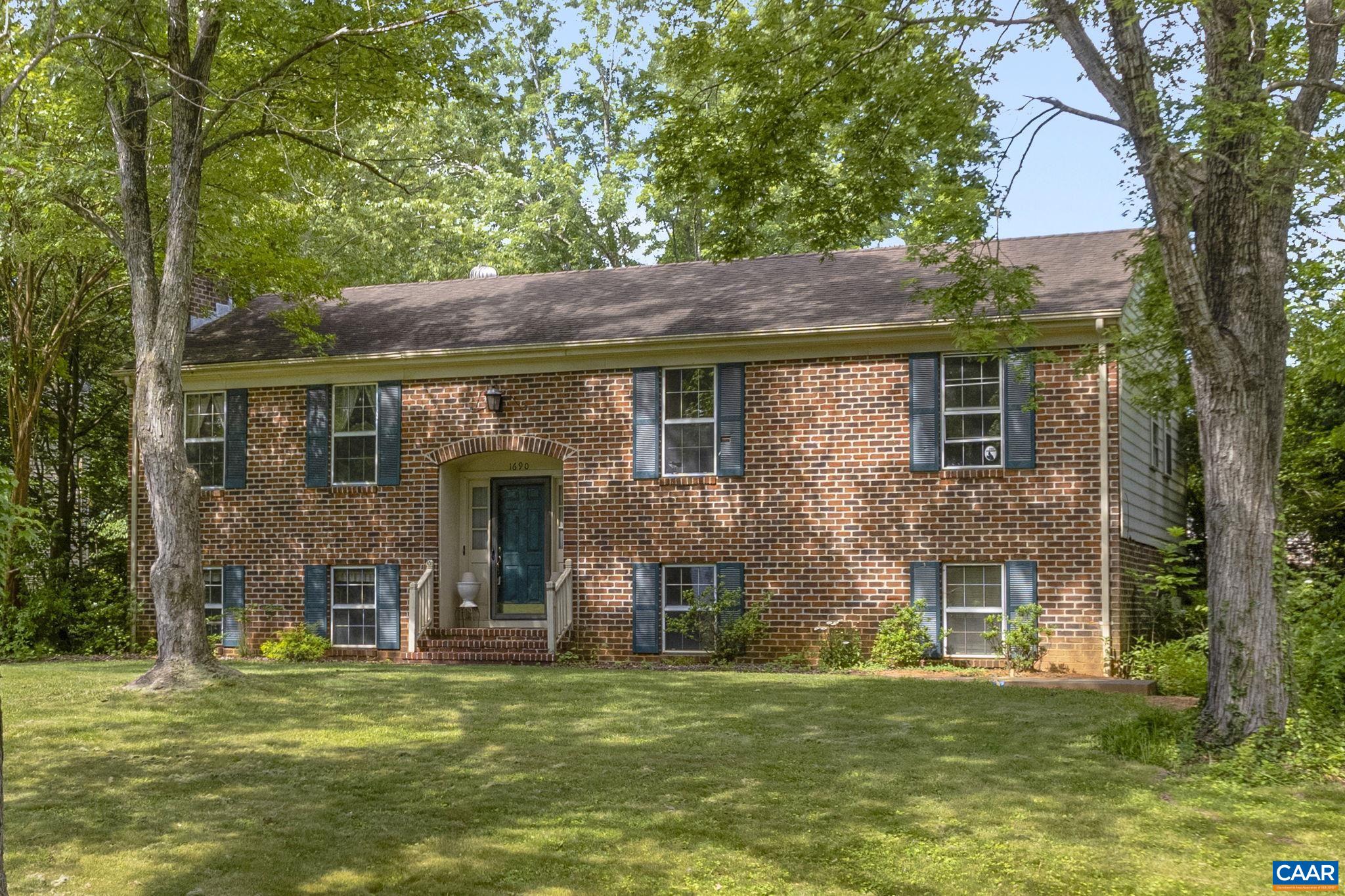 You will not want to miss the charm of this brick split-level located in Hollymead! Upon entering your main level, you will find beautiful hardwood flooring throughout the living room, dining room and hallway. Three bedrooms upstairs to include your primary bedroom. Bring your ideas to update your kitchen and bathrooms! The lower level offers you an additional living space, full bathroom and two additional bedrooms. Lightly wooded yard provides you ample opportunity for outdoor relaxation. New carpet throughout the lower level and all bedrooms (both upstairs and downstairs). Fresh paint in all bedrooms, foyer, trim, and all bedroom and closet doors.  All this just minutes away from Hollymead Town Center, the Charlottesville airport, and only 15 minutes from downtown, and UVA!!