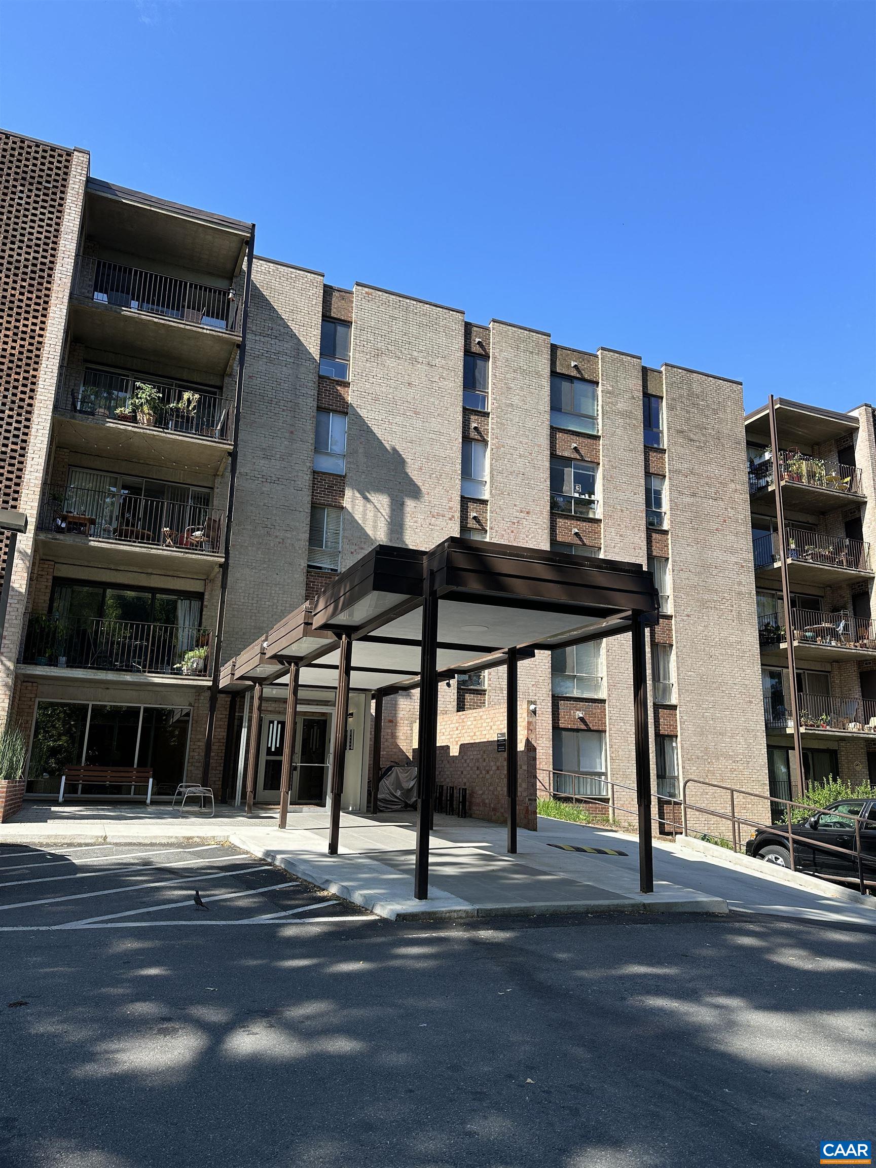 Downtown condo!  Comfortable, easy living.  This one bedroom condo has private balcony overlooking trees and nature!  New tub with gorgeous ceramic tile tub surround.  Granite countertop in kitchen.  Parquet floors, laundry facility in building, parking.  Association dues include utilities!  Near downtown mall, city market, UVA, fine dining, shows!  Convenient to everything!