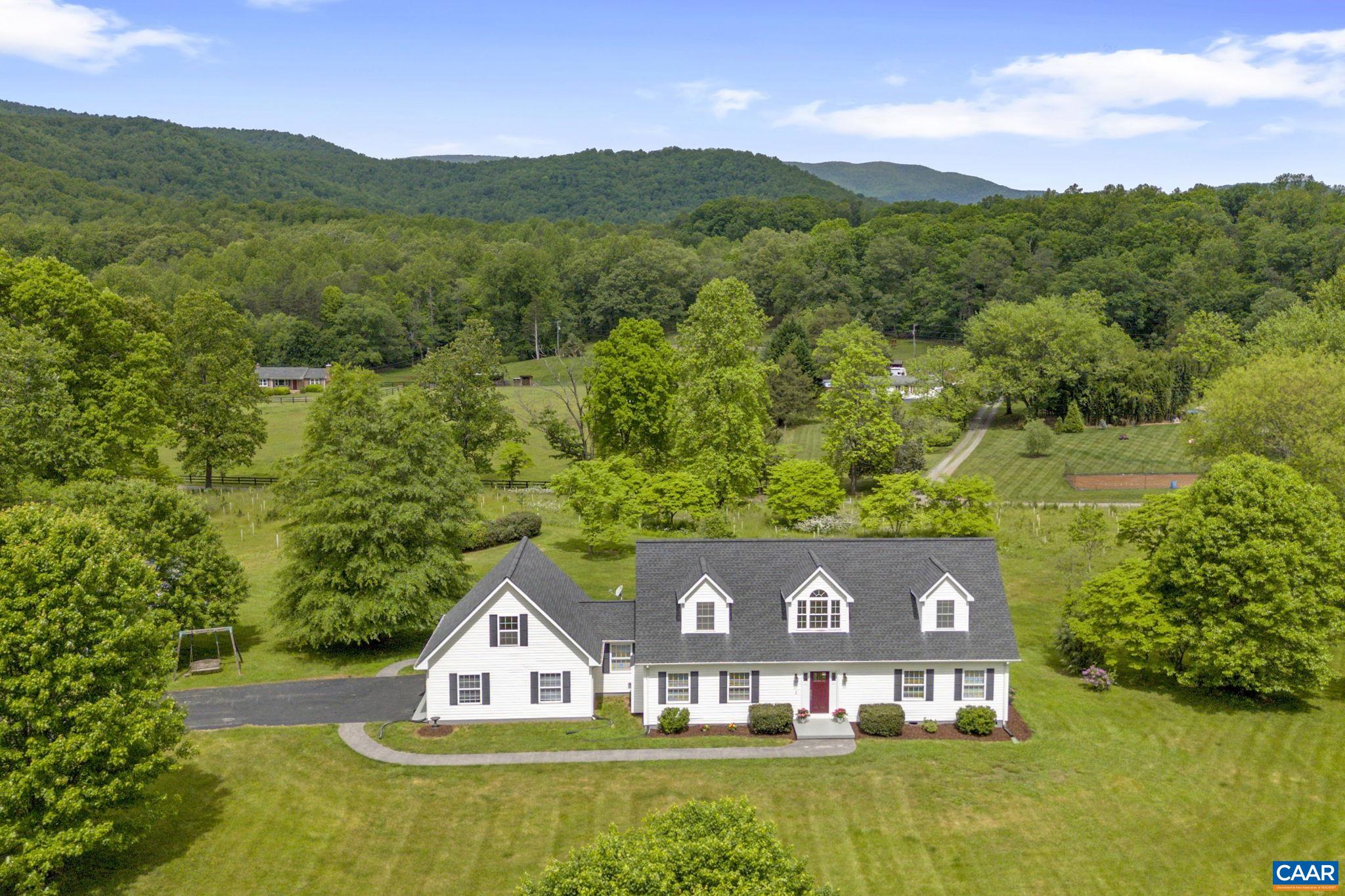 OPEN HOUSE SUNDAY 1 - 3 PM!There is so much to see here! Located in gorgeous Free Union and surrounded by mountain views, you'll feel tension melt away as you enjoy this beautiful home. With a first-floor primary bedroom suite, two generous closets, a soaking tub and stand up shower, plus a first floor office, this property is accommodating to all! There is a family room with gas logs fireplace on the main level, and a large room upstairs with fantastic views currently used for indoor games. The two upstairs bedrooms are so spacious, with amazing views front and back and enormous walk in closets. There is even room for expansion over the garage.  The floorplan makes sense: the garage leads to the mudroom, pass the laundry and straight to the kitchen. The kitchen opens up to the back deck for grilling and more outdoor enjoyment.  With nearly 4 acres of mostly level land there is so much to enjoy.  A portion of the property has been planted with native trees in cooperation with Soil and Conservation. Ask your Realtor to share the Documents of the listing with you.  There is a lot of great information available.  Get away from it all, but stay connected with Firefly.  Free Union lifestyle; Western Albemarle High School. Welcome home!