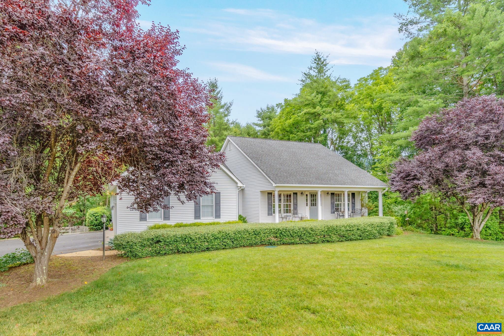 Enjoy serene country living in Advance Mills Village, Northern Albemarle County.  This attractive 4 bedroom, 4 bath home has been ultra-well maintained through the years and now includes an additional (guest)  bedroom, workshop and full bath in the walk-out terrace level. The thoughtful layout offers true one-level-living with a split plan which has all bedrooms nicely tucked away for everyone's privacy and comfort. The central Great Room includes beautiful Oak floors, vaulted ceiling and a newly updated gas Log fireplace. Upstairs you'll find the large Bonus room which could serve many purposes such as playroom, crafting, or hide-away.  The 4.69 acre parcel comprises a sweeping open front yard space plus a manicured fenced-in back yard area. These yard spaces are surrounded by mature forest which then slopes down to Marsh Run, a stream which delineates the Northern border of the parcel. The private walking trail follows down hill then along the banks of the river and provides an amazing recreational feature to explore and enjoy in all seasons. Cool off in the stream on one of rock ledges over which the stream flows.  Come have a look..