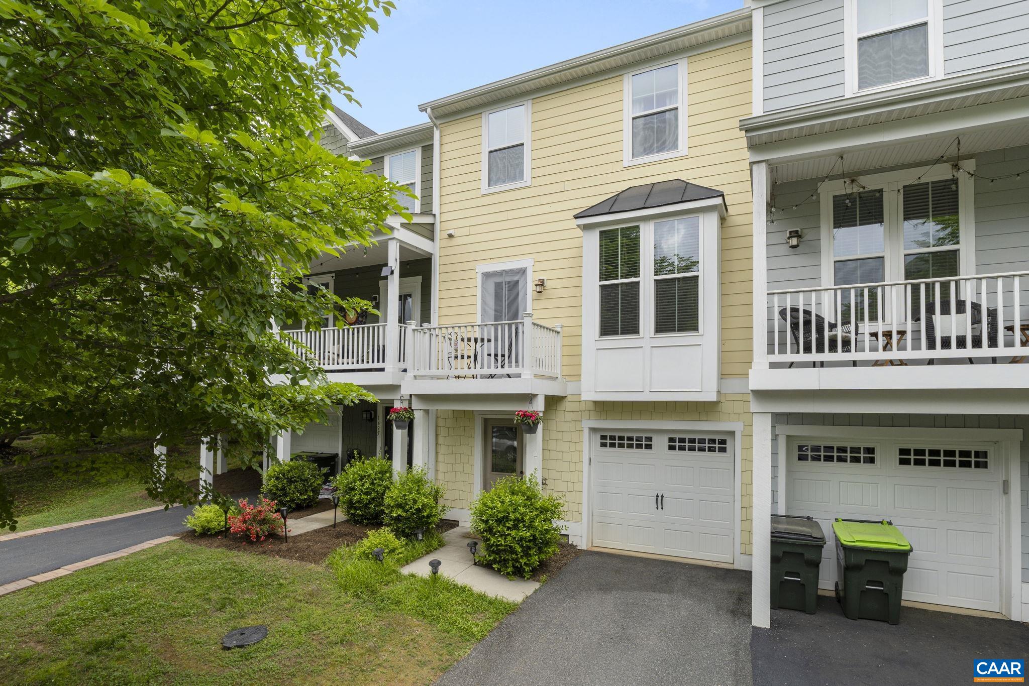OPEN HOUSE Friday 5/17 12-2PM and Sunday 2-4PM. Beautifully maintained Crozet townhouse for under $400K - welcome to 1497 Wickham Pond Dr.! Step inside to a welcoming foyer that leads into a versatile rec room, ideal for a home office, workout space, or guest room. The upper two levels feature updated high-quality LVP flooring, extending into the bedrooms. Tall ceilings allow natural light to fill the main level. The open-concept kitchen boasts stainless steel appliances, granite countertops, a generously sized island, and ample dining space. Enjoy outdoor living with a sunny front porch, a back deck with a retractable awning, and a fenced-in backyard. The primary suite upstairs features a tray ceiling, a walk-in closet, and a bathroom with a glass shower and accented tile. Additional storage is available in the 1-car garage. Wickham Pond offers amenities for easy living, including an exercise room, trail system, clubhouse, play area, and comprehensive exterior maintenance (roof included!). This well-established neighborhood is a Western Albemarle sweet spot, just minutes from downtown Crozet and 15 minutes to Charlottesville.
