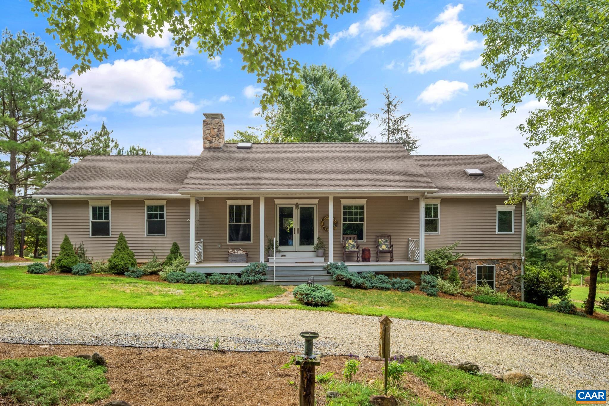 One owner, custom built home in a prime Afton location! Perfectly sited to enjoy privacy and nature at its best.  Property has been well maintained, landscaped and groomed like a personal park (a couple notable additions: 10 maples that turn bright colors in the Fall and 4 rose of Sharon for color in the summer.) Home features a one level, open floor plan with lots of natural light, hardwood flooring, vaulted ceilings, and wood burning fireplace. Spacious primary suite with private bath.  Two additional guest bedrooms and full bath.  Plus an unfinished basement for storage, or to expand if needed, and an attached two garage.  Lovely covered front porch for morning coffee and a generous rear deck perched off the back for entertaining.  Wired for portable generator.  Located minutes from Nelson 151 activities – brew/wine trail, Nellysford Farmers Market, Wintergreen Resort and only 30 minutes to Charlottesville.  This home is perfect in so many ways!