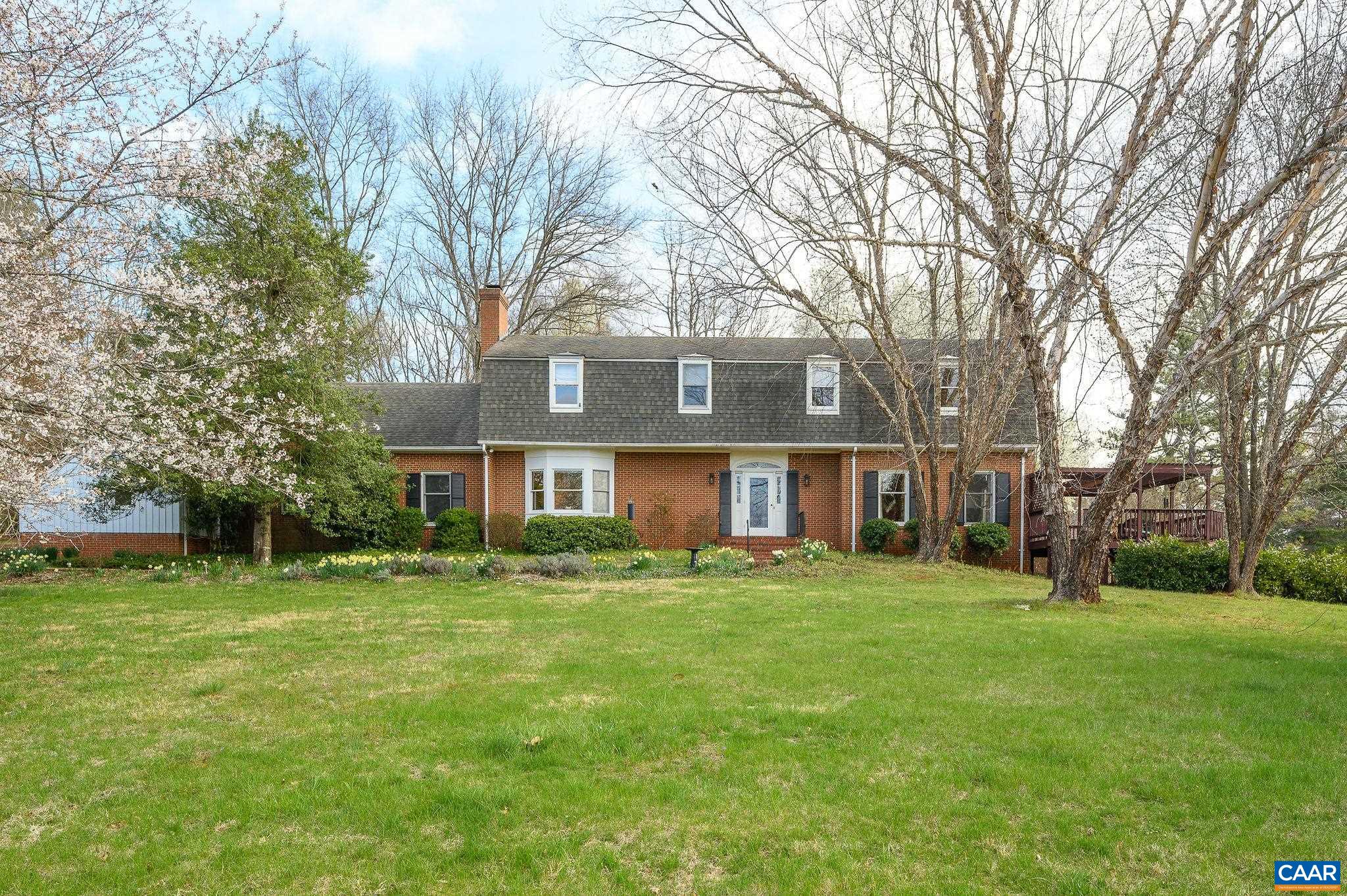 Superb Home in the Heart of Ivy, Greencroft Neighborhood. The 2.5 park-like acres with mountain views set on a quiet cul-de-sac provide a balance of both privacy and neighborhood living. Large rooms, ceiling heights of 9 ft., hardwood floors. Flexible floorplan allows for formal and informal spaces with easy indoor outdoor flow to patio and large deck. First floor primary bedroom with en-suite full bath. Views from living room and family room each with fireplace.  Dining room, private office, half bath, and eat-in kitchen with mudroom entry complete the first floor. The second floor has two additional large bedrooms both with en-suite baths and generous closets. Beautiful open second floor landing offers ideal space for a library, hangout room, etc. Unfinished basement with roughed-in Bathroom. Two car garage with attached shed and propane generator. Just minutes from the Ivy Post Office, Duners, and Greencroft Club. A Gardner's delight- Beautifully Landscaped 2.5 acres with mature native trees, shrubs and perennials, sunny garden spots, rolling lawn. Murray Elementary, Henley Middle School and Western Albemarle High School district.