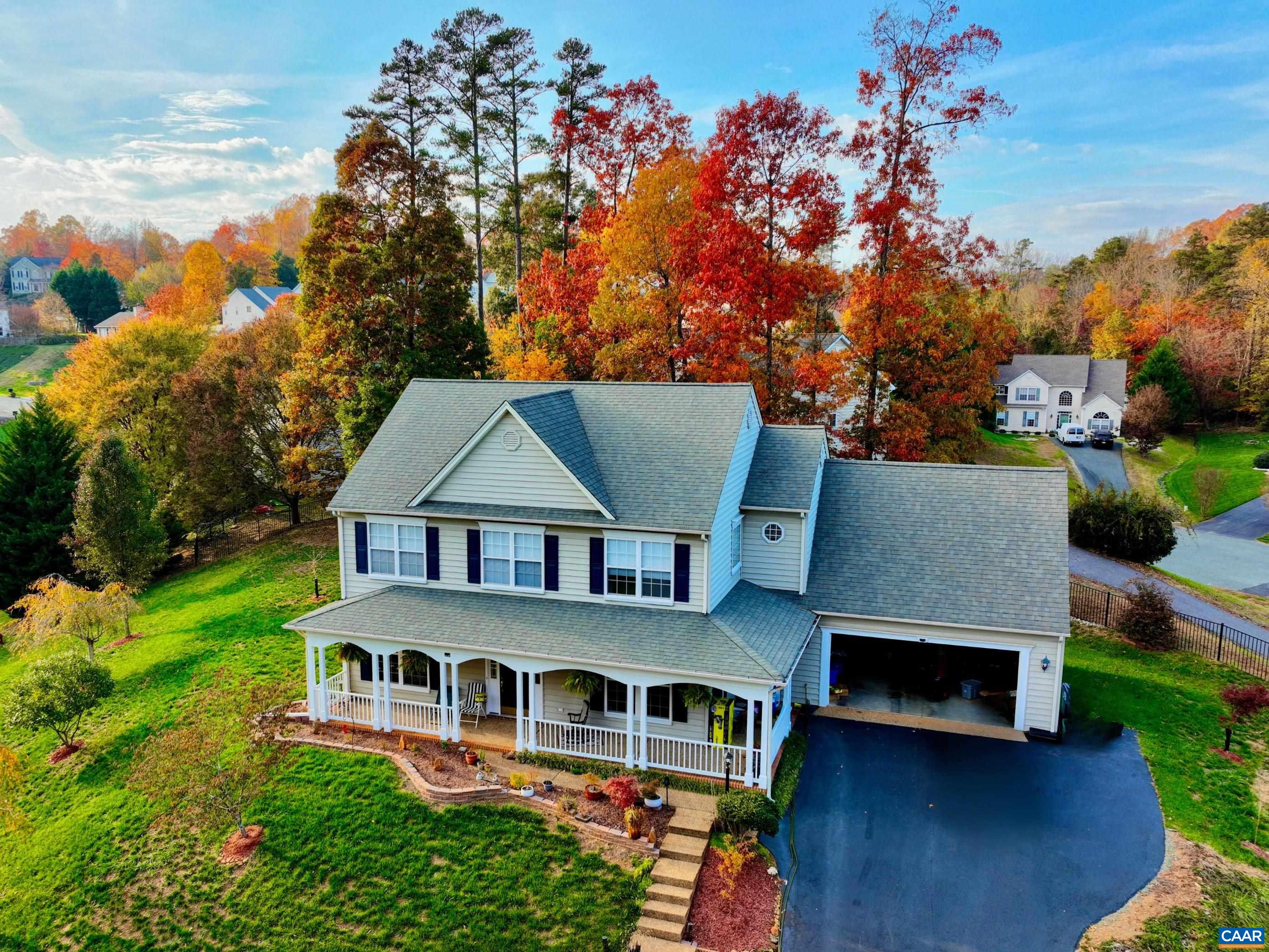 A VIEW FROM THE TOP IN FOXCROFT COMMUNITY! Enjoy the changing of the seasons from your wraparound front porch, as this 4 BR/2.5 BA home is strategically situated on a hill, offering scenic views from the cul-de-sac. Located just minutes from Downtown Cville in the Foxcroft Community, the home boasts a fantastic floor plan featuring an open-concept kitchen, family room, and breakfast area filled with natural light. A cozy gas fireplace adds ambiance to the living space. There are 9-ft ceilings throughout the Main Level, as well as a formal dining room and a large office. The spacious Master Suite on the 2nd level features a vaulted ceiling and includes an oversized bathroom with a separate tub & shower, dual vanity, and a walk-in closet. Enjoy outdoor living on the patio in the private, flat backyard. Recent upgrades include a brand-new electric range (2024), new HVAC system (2022) with a transferable warranty, and newer water heater (2021).