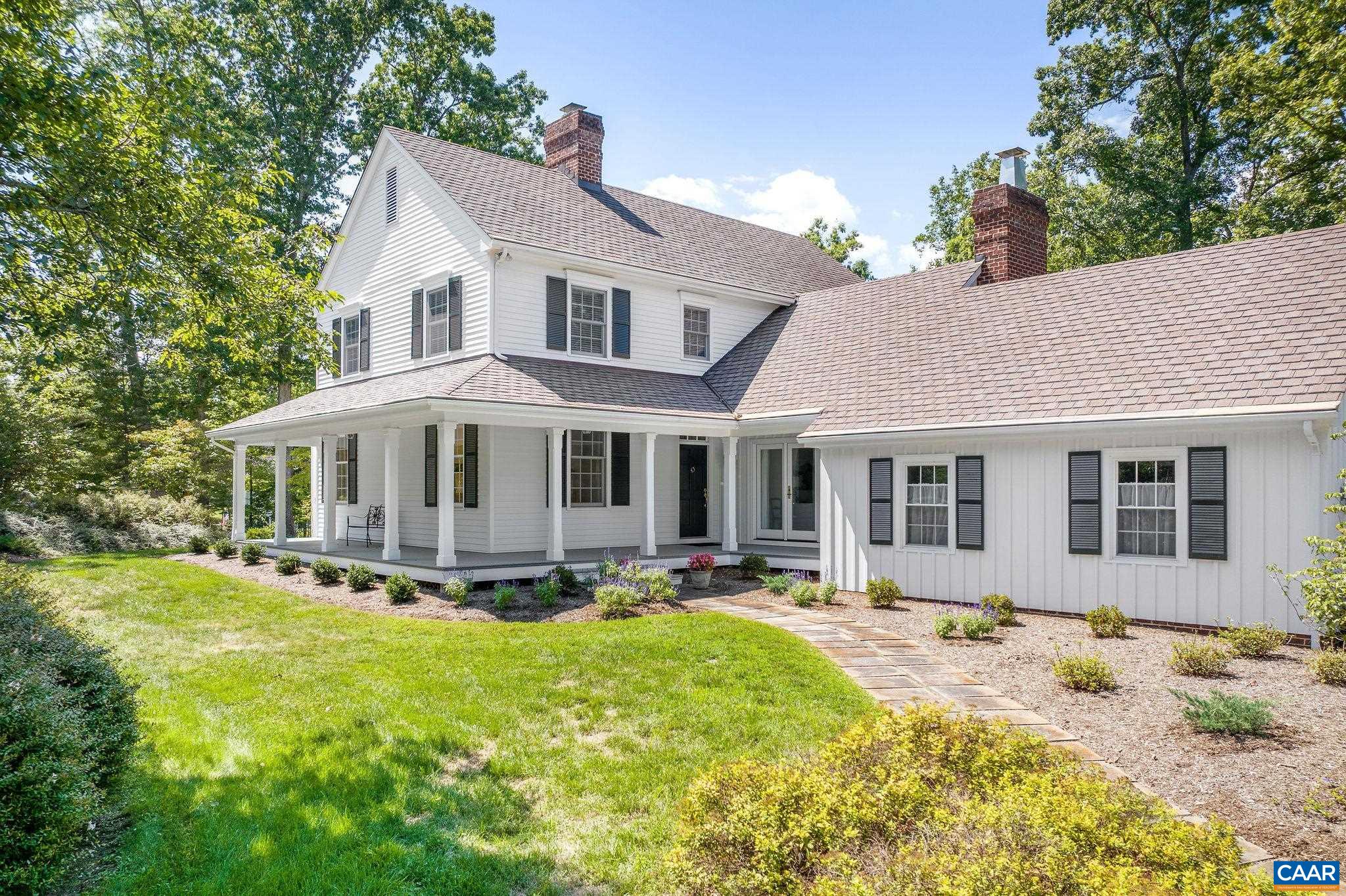 The storybook, farmhouse-style home was constructed to the highest standards and has been impeccably maintained.  The parcel provides complete privacy and tranquility in a neighborhood setting 15 minutes west of Barracks Road conveniences.  The light, bright interiors feature 9 foot ceilings or higher, blond hardwood floors, 2 fireplaces (family room and living room), a vaulted family room, and a Mexican tile floored, sunny eat-n kitchen.   Outdoor living and entertaining spaces incl' a wraparound front and side porch, screened bluestone porch off the family room and bluestone terraces off the living and dining rooms.  1st floor laundry room off the kitchen.  Full, unfinished basement for storage or future expansion.  There are strong winter Blue Ridge views.  The parcel features mature landscaping and a mix of level and somewhat sloping lawns. Zero road exposure and located near the cul de sac at the back of the neighborhood (ideal for scooters and such).  Ivy Elementary School.