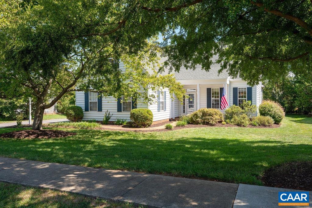 Charming, impeccably-maintained home in Grayrock, popular for its convenience, Blue Ridge views & walkability. You'll live on the vaulted, custom-built screened porch overlooking the gorgeous landscaping & level, grassy backyard. Highlights include: spacious 1st floor primary suite w/ deluxe bath & walk-in closet, elegant, 2-story living room w/ gas fireplace & delightful eat-in kitchen w/ stainless appliances (all new since 2022), solid-surface counters, island & tile backsplash. Enjoy 3 additional bedrooms & full bath upstairs, large bedroom over garage would make an ideal office or rec. room. Roof replaced in 2019 & heat pump replaced in 2017. HW floors, tile baths, new powder rm, new paint & lighting. Grayrock amenities include a play area, walking trails, pond & basketball court. Walkable to downtown Crozet, Western schools, Chiles Peach Orchard & King Family Vineyards!